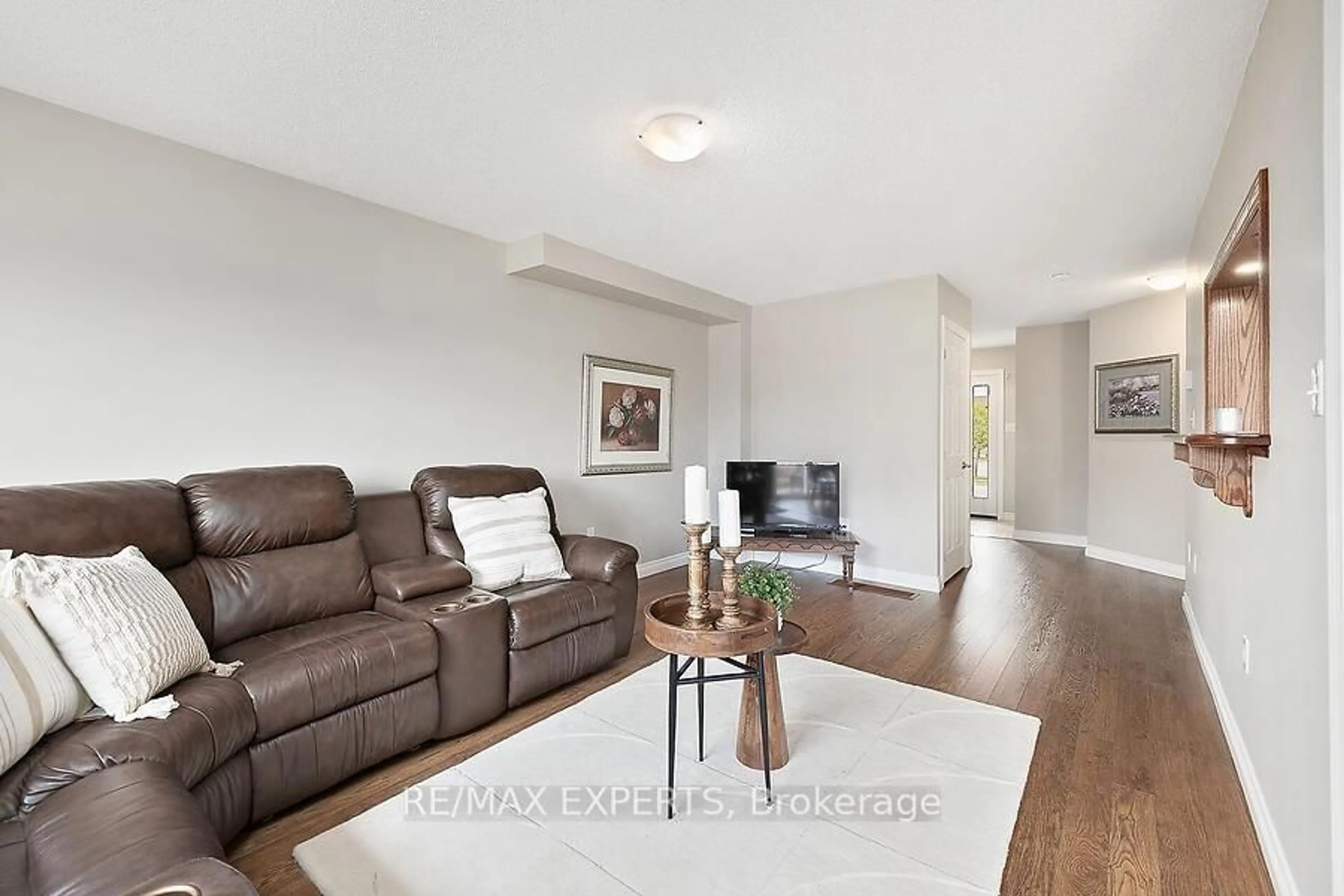 Living room with furniture, wood/laminate floor for 2104 Galloway St, Innisfil Ontario L9S 0H5