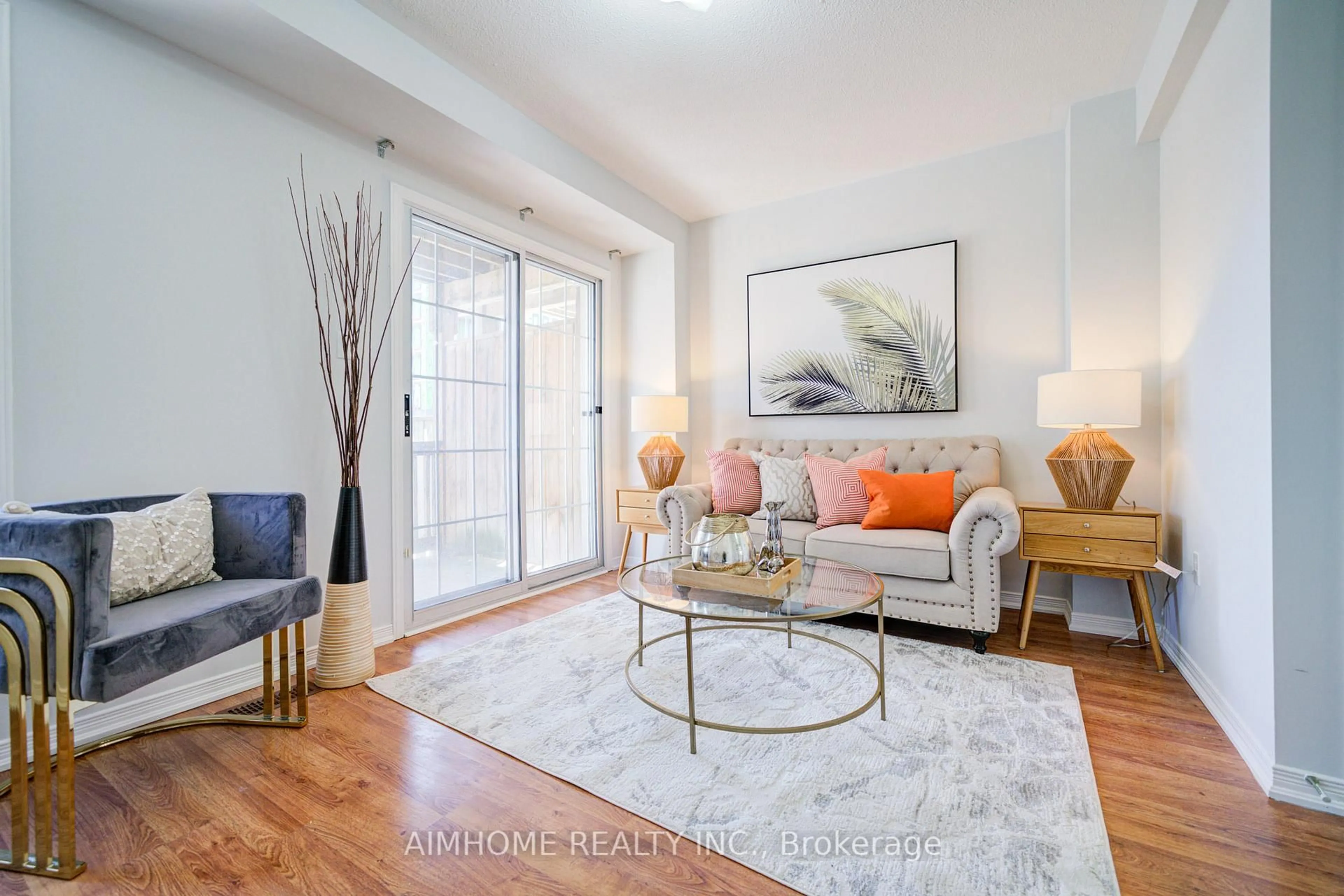 Living room with furniture, wood/laminate floor for 27 Warrington Way, Markham Ontario L6C 0B9