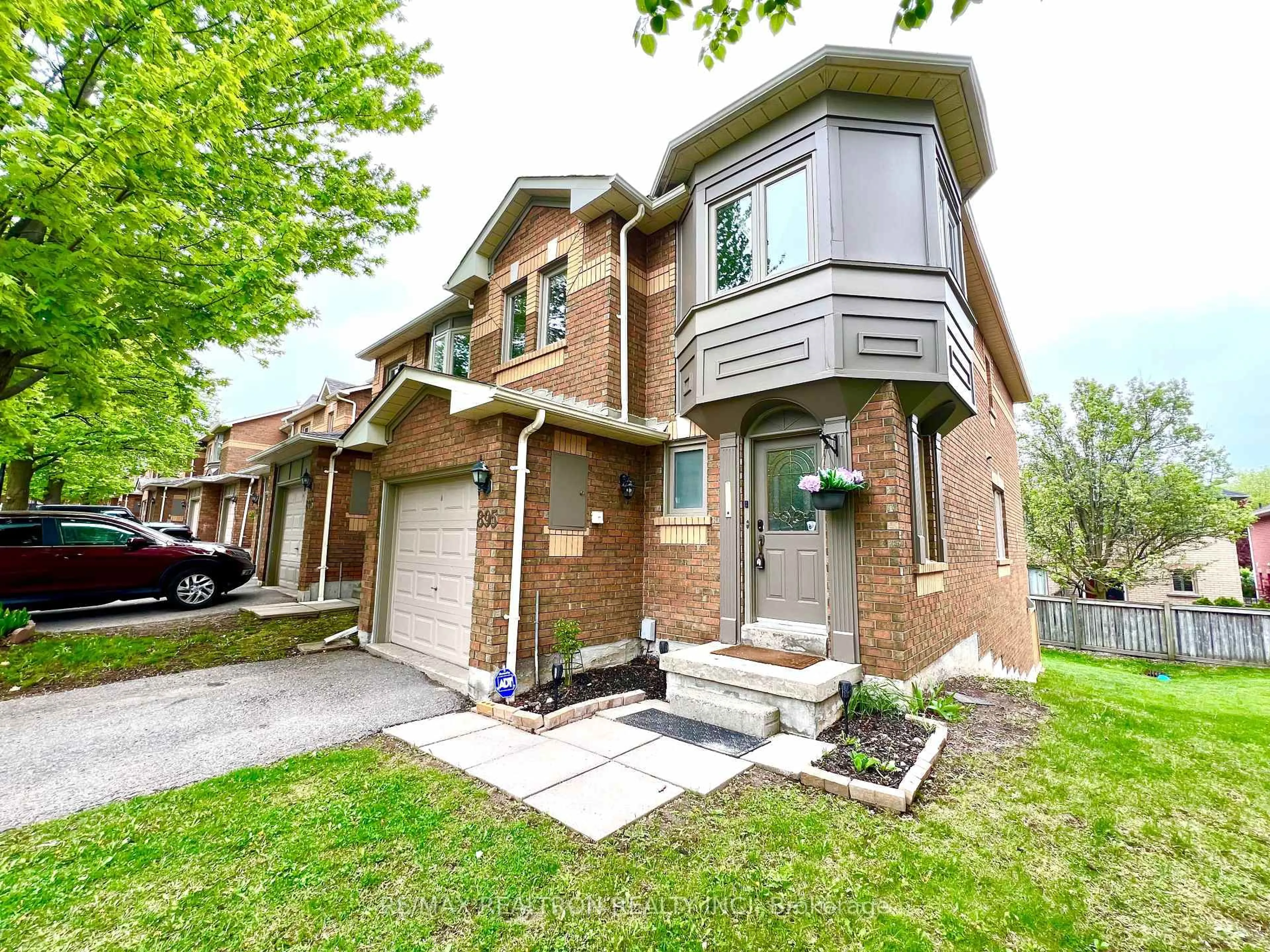 Home with brick exterior material, street for 895 Caribou Valley Circ #15, Newmarket Ontario L3X 1W9