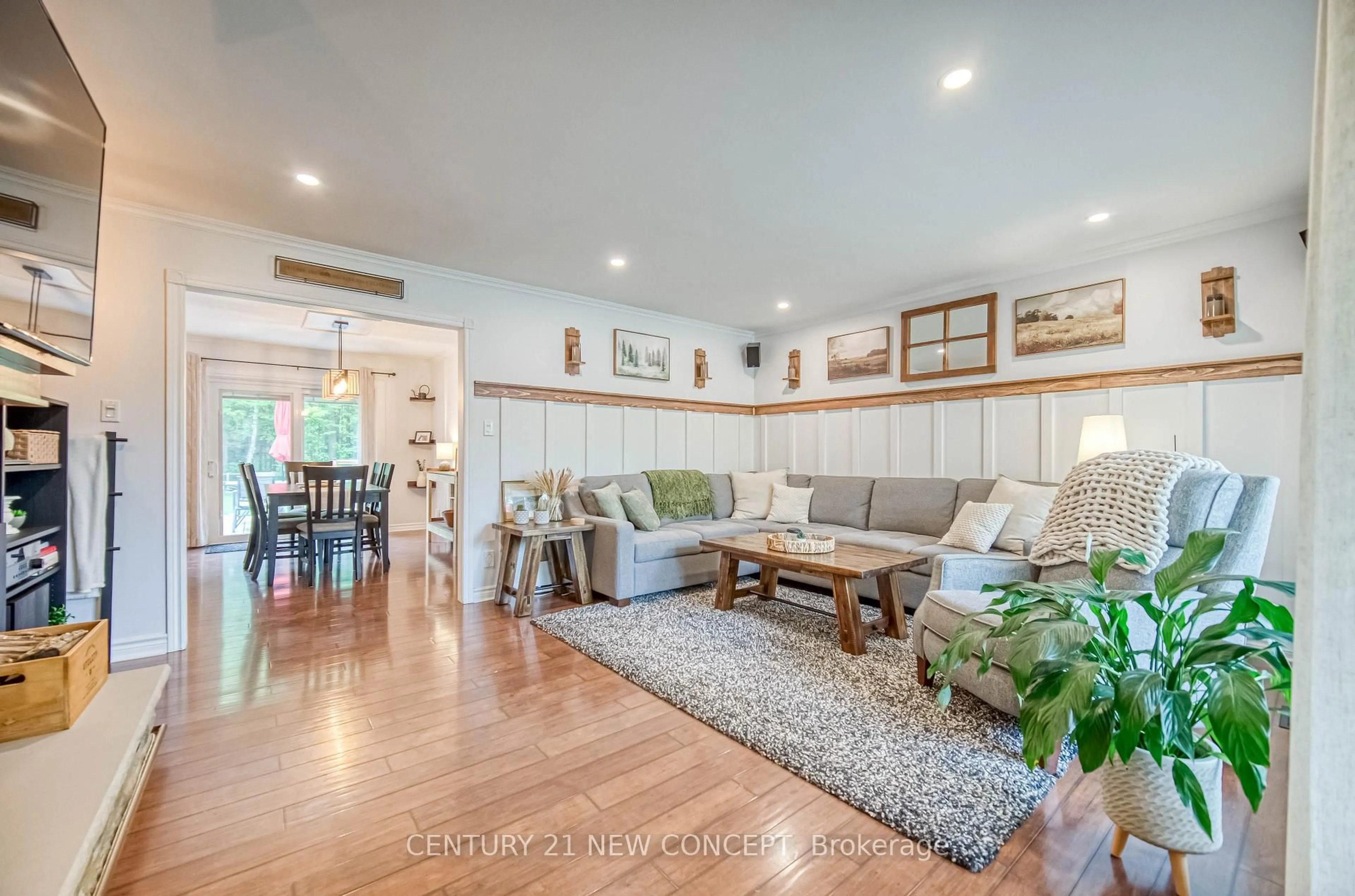 Living room with furniture, wood/laminate floor for 5531 Black River Rd, Georgina Ontario L0E 1R0