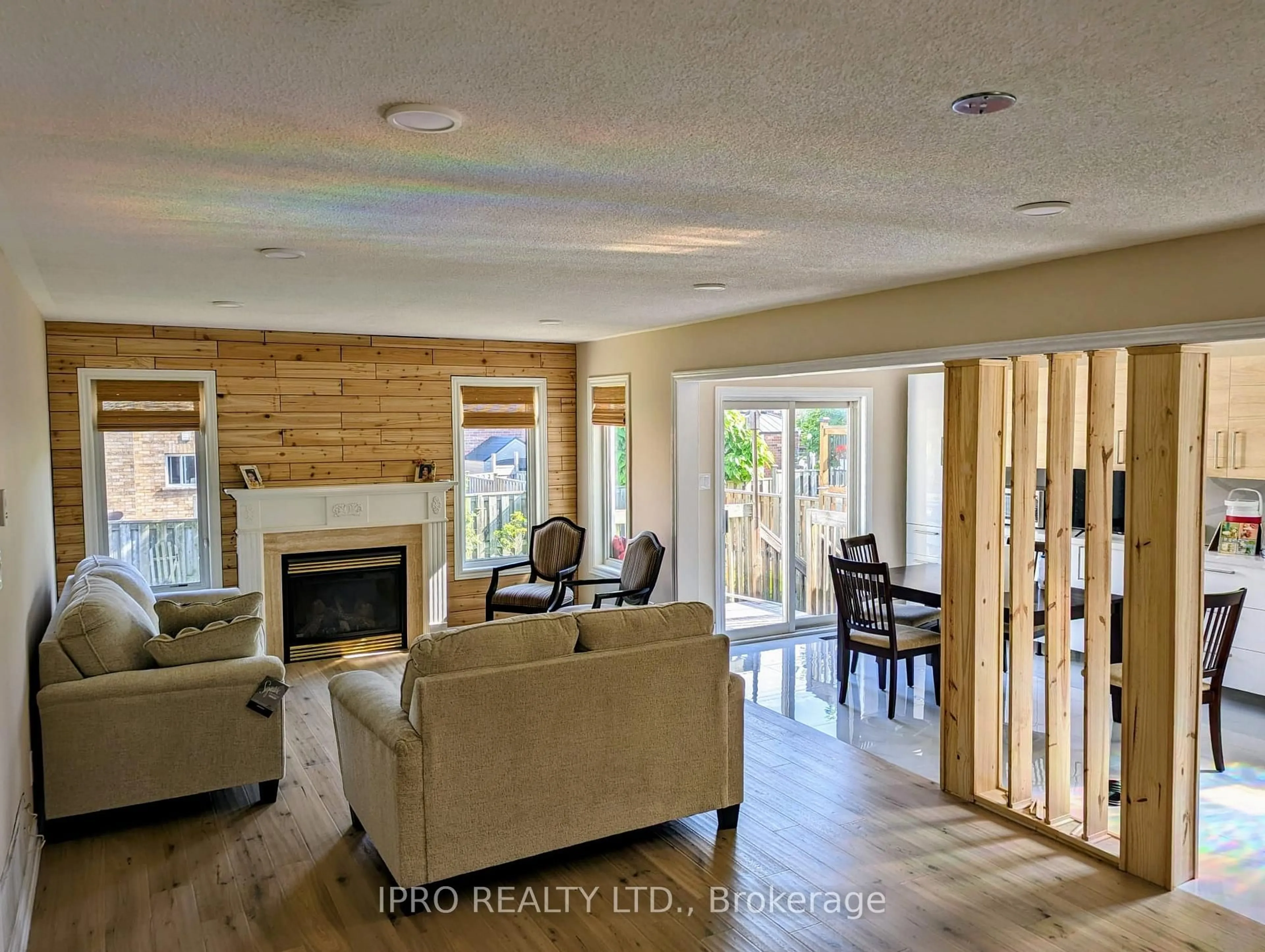 Living room with furniture, wood/laminate floor for 75 Ian Dr, Georgina Ontario L4P 4G2