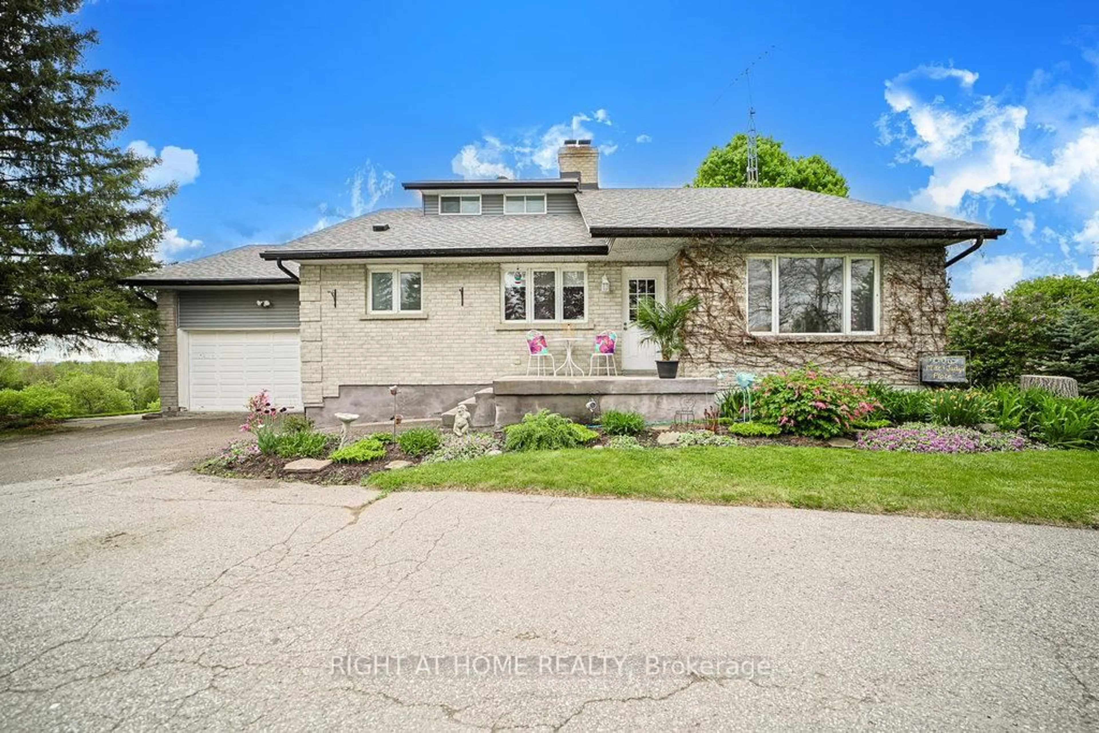A pic from outside/outdoor area/front of a property/back of a property/a pic from drone, street for 5909 13th Line, New Tecumseth Ontario L0L 1L0