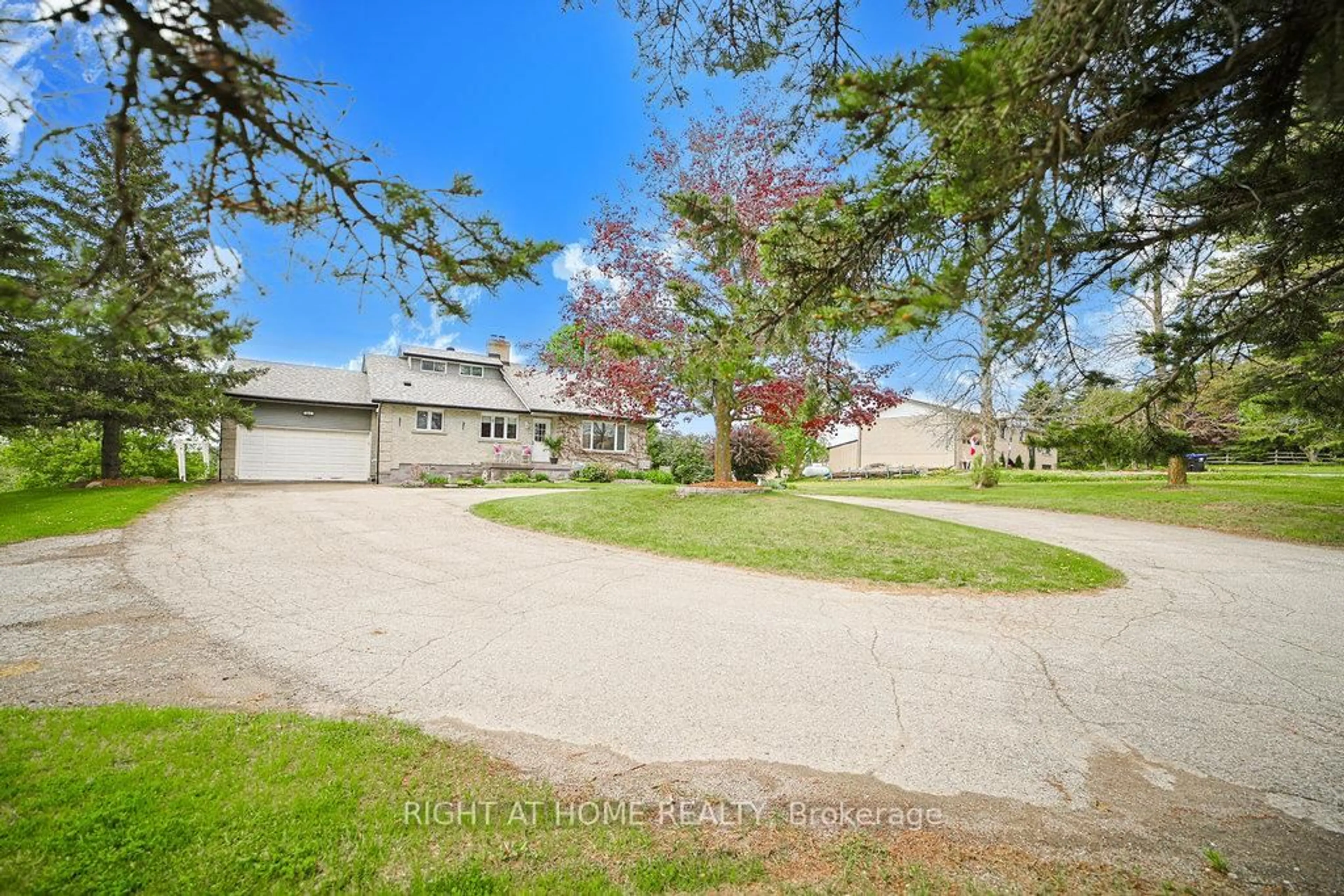 A pic from outside/outdoor area/front of a property/back of a property/a pic from drone, unknown for 5909 13th Line, New Tecumseth Ontario L0L 1L0