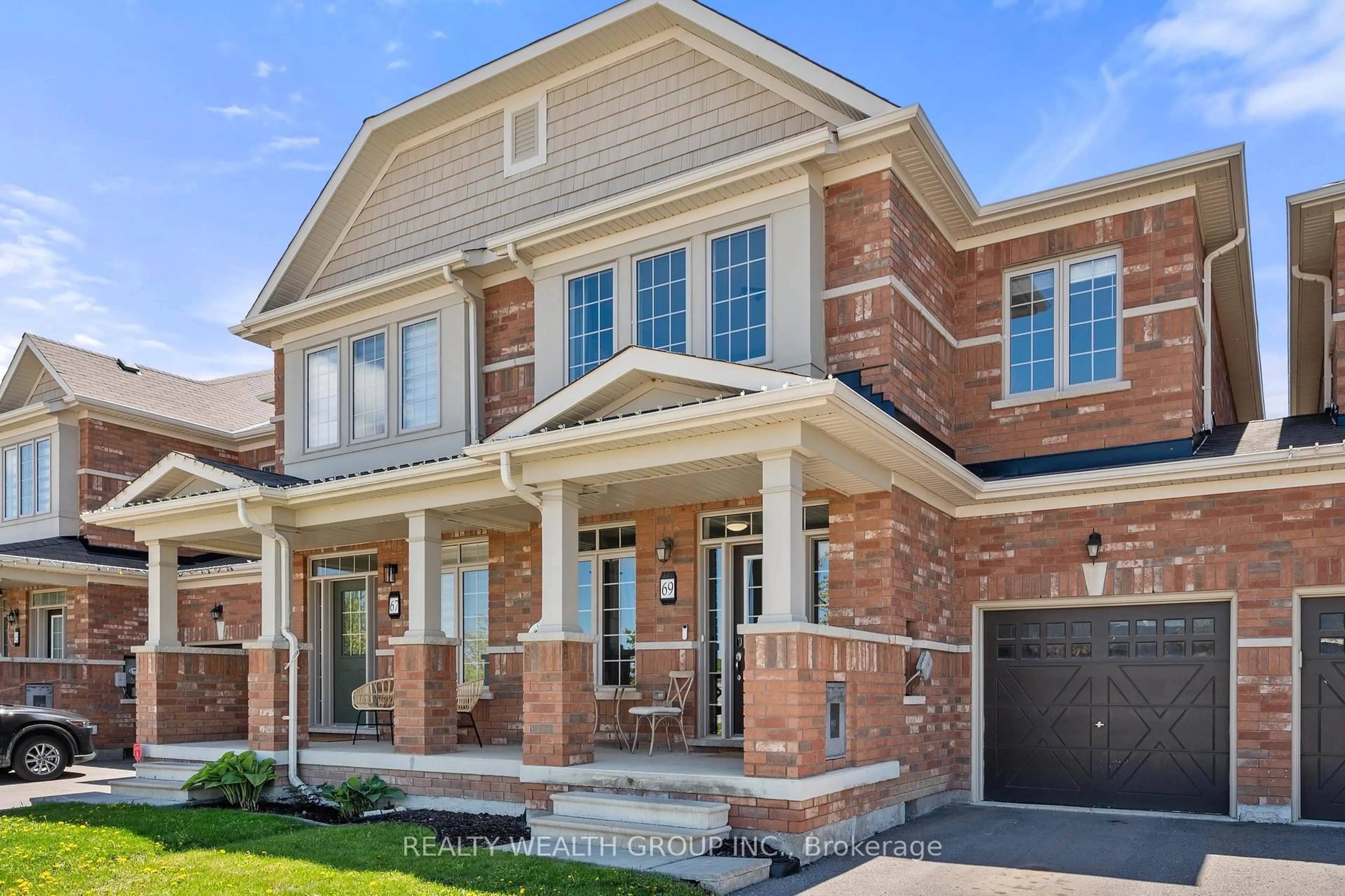 Home with brick exterior material, street for 69 Jim Mortson Dr, East Gwillimbury Ontario L4H 3Z7