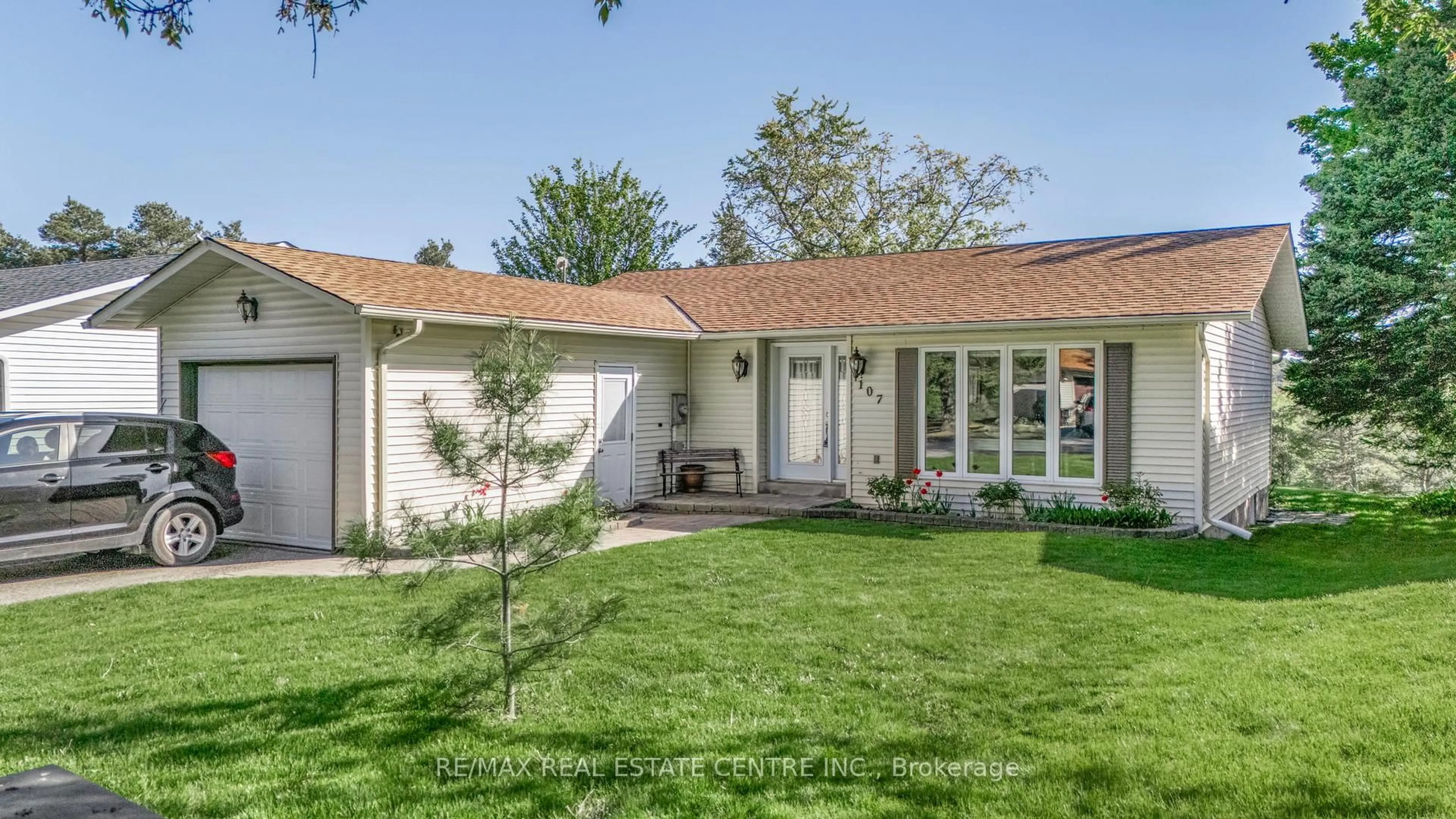 Home with vinyl exterior material, street for 107 Tecumseth Pines Dr, New Tecumseth Ontario L0G 1W0
