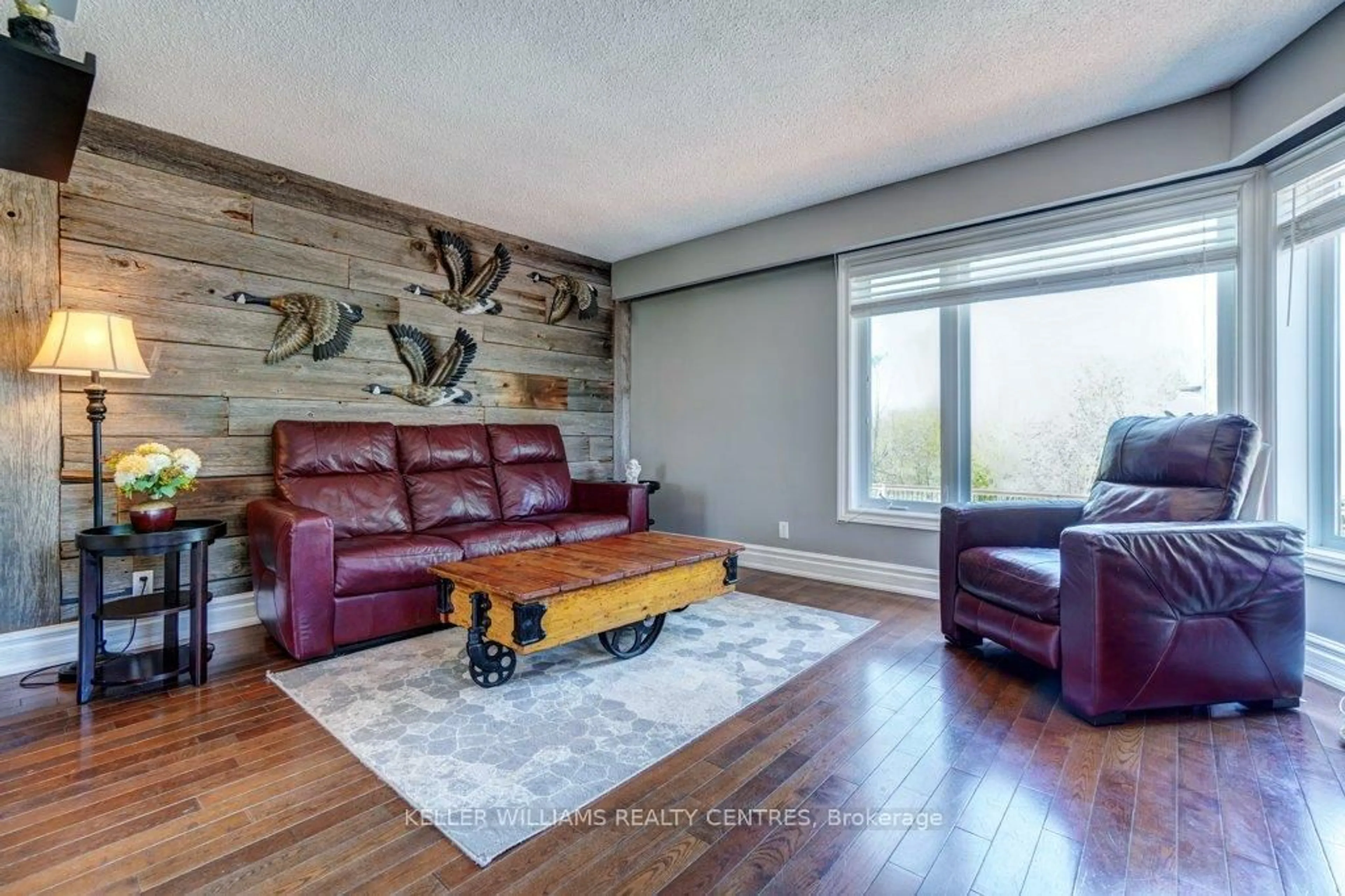 Living room with furniture, wood/laminate floor for 34 Meadowlands Dr, Brock Ontario L0E 1E0