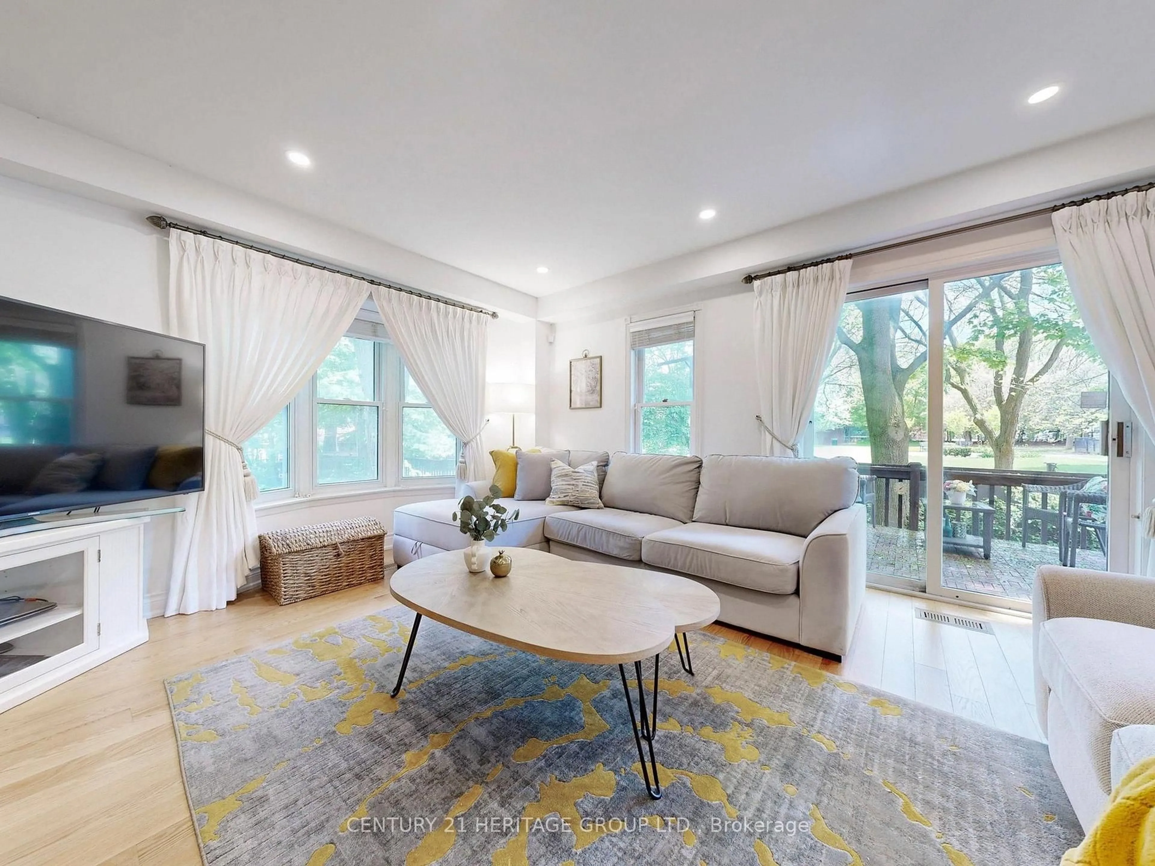 Living room with furniture, wood/laminate floor for 108 Confederation Way, Markham Ontario L3T 5R5