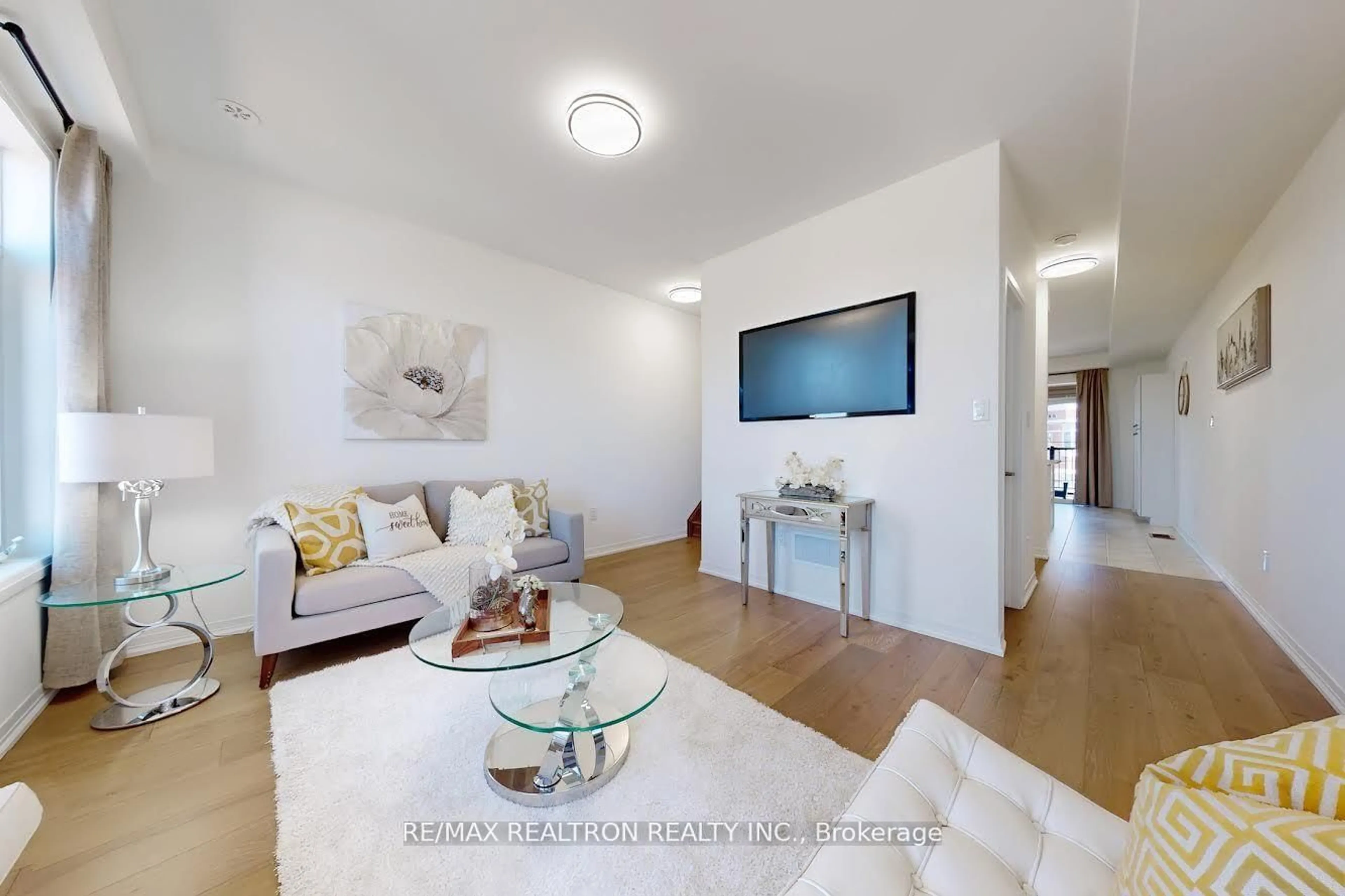 Living room with furniture, wood/laminate floor for 53 Carneros Way #Way, Markham Ontario L6B 1R2