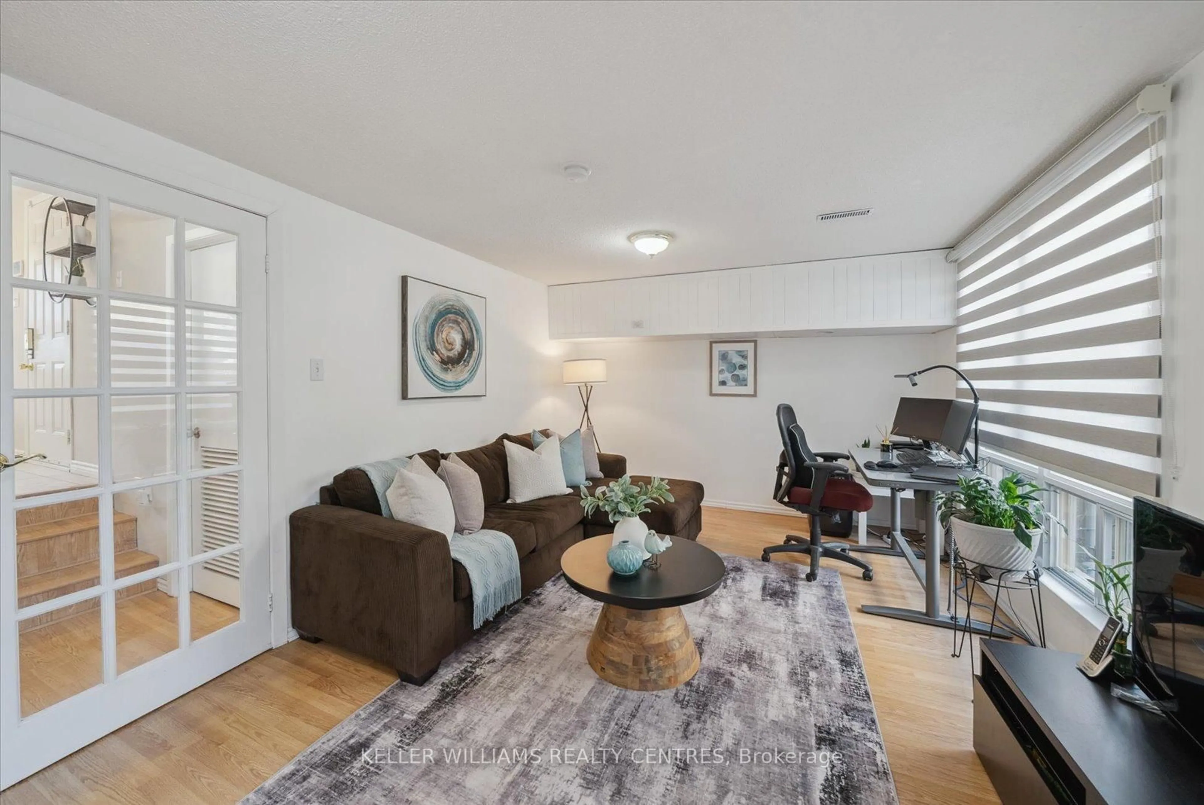Living room with furniture, wood/laminate floor for 73 Poplar Cres, Aurora Ontario L4G 3M4
