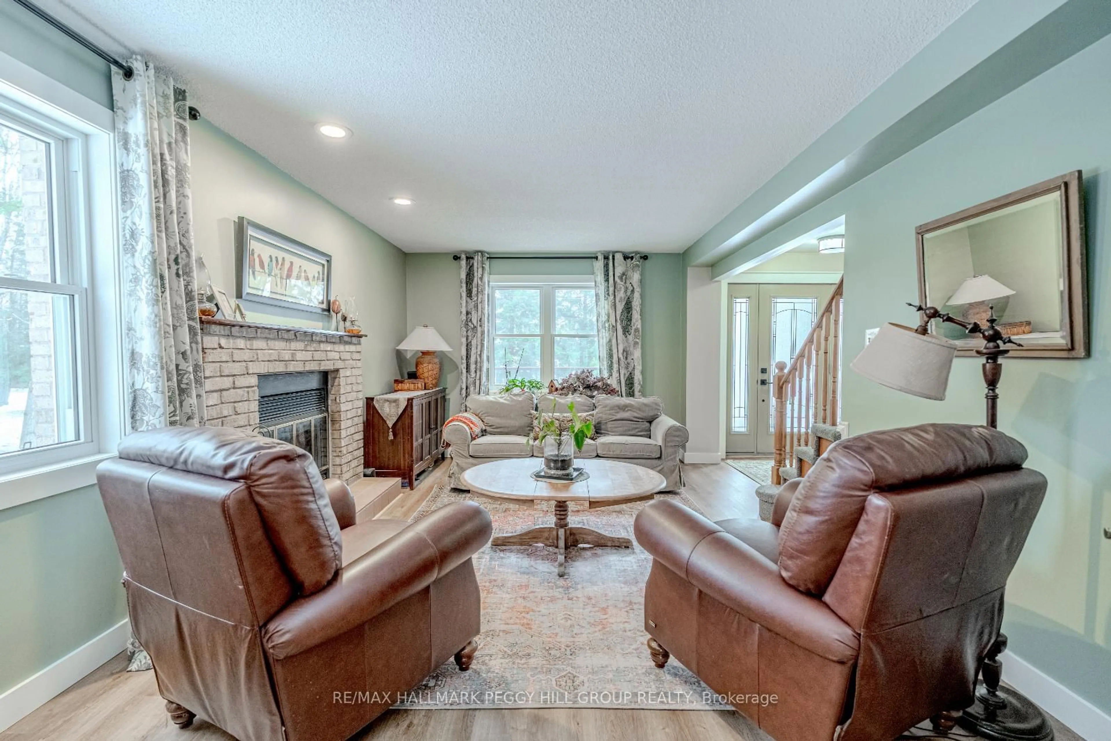 Living room with furniture, ceramic/tile floor for 7816 6th Line, Essa Ontario L0M 1T0