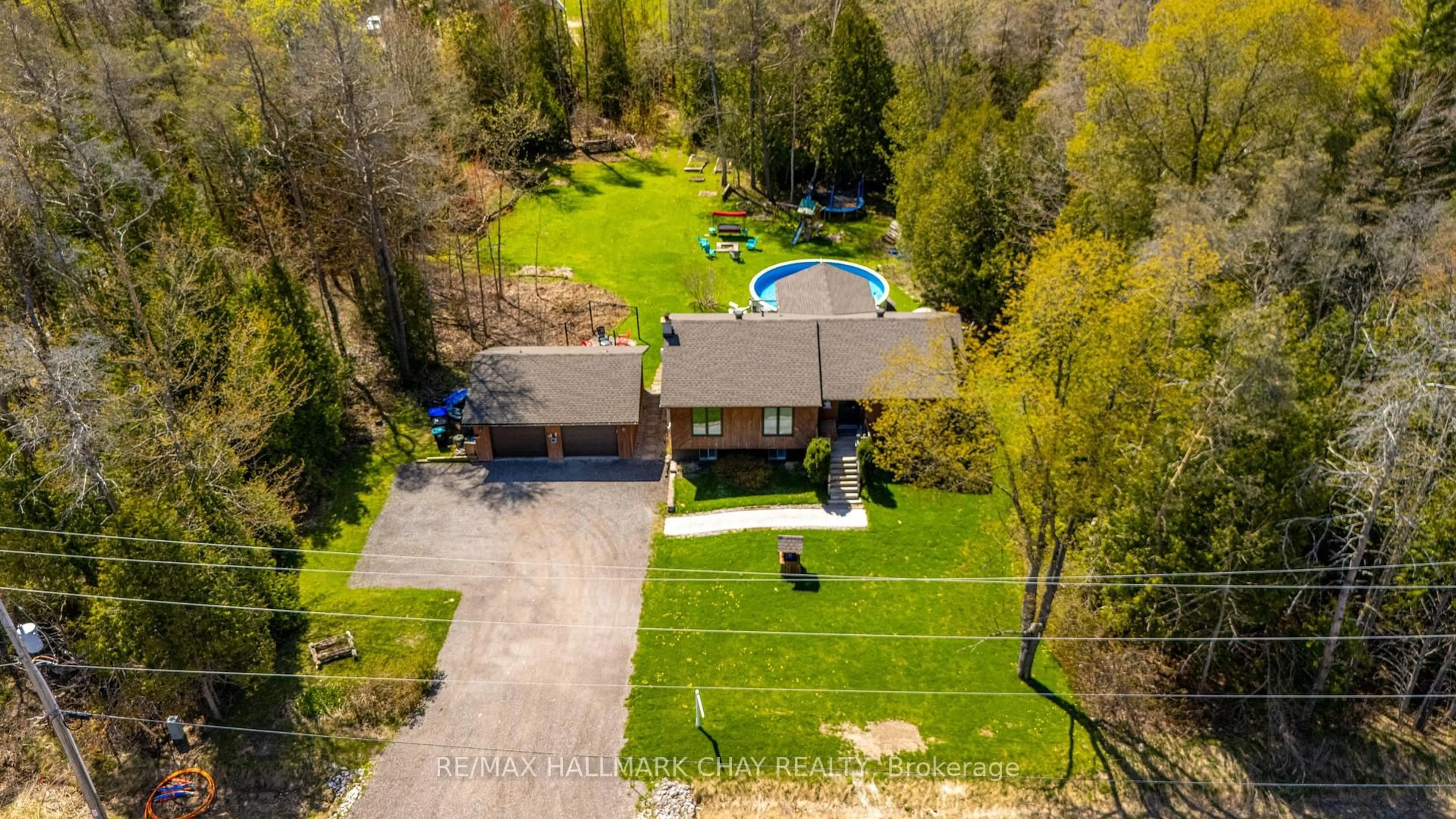 A pic from outside/outdoor area/front of a property/back of a property/a pic from drone, street for 7912 County Road 56 Rd, Essa Ontario L0M 1T0