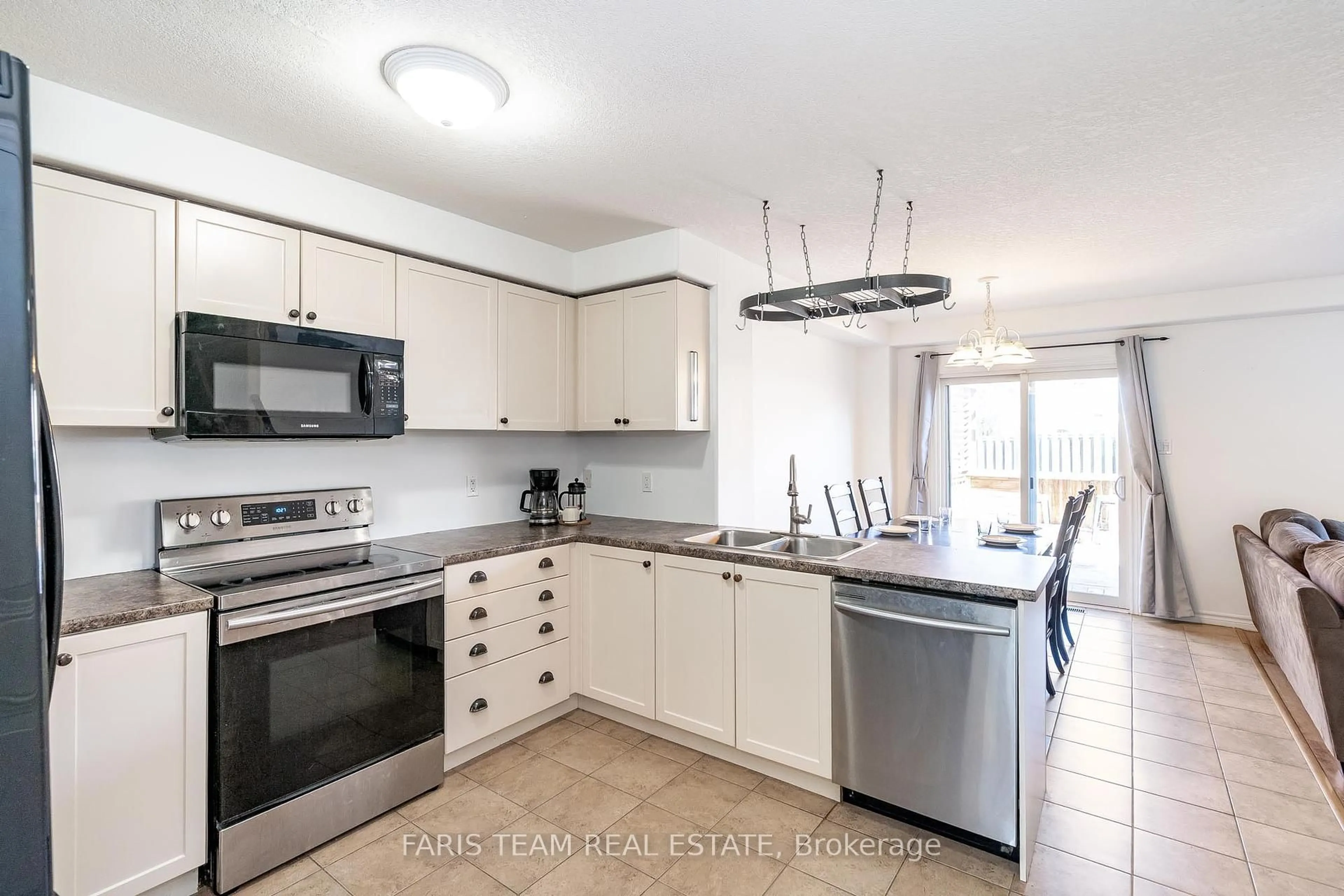 Open concept kitchen, ceramic/tile floor for 108 Quigley St, Essa Ontario L0M 1B6