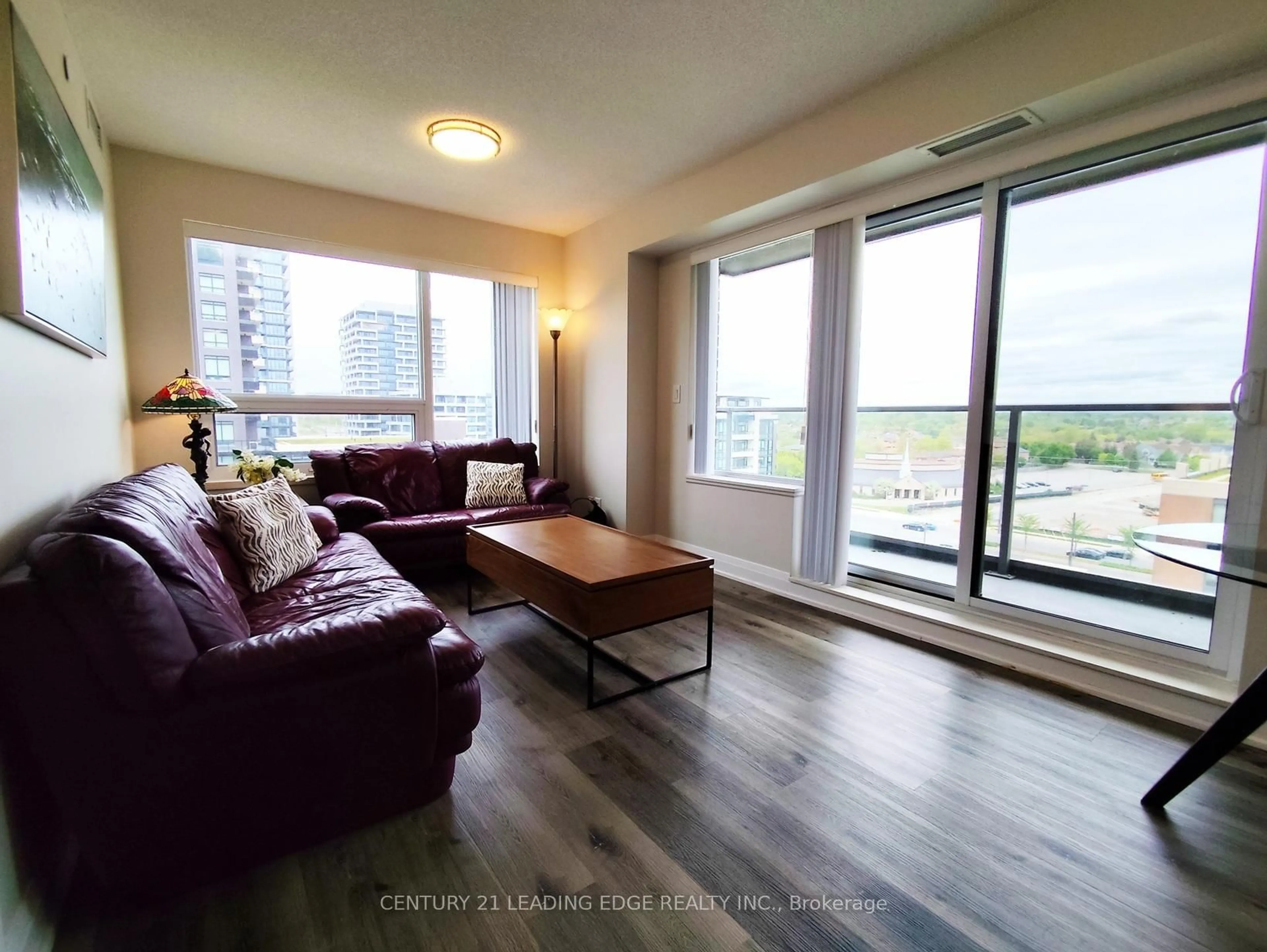 Living room with furniture, wood/laminate floor for 18 Uptown Dr #1010, Markham Ontario L3R 5M5