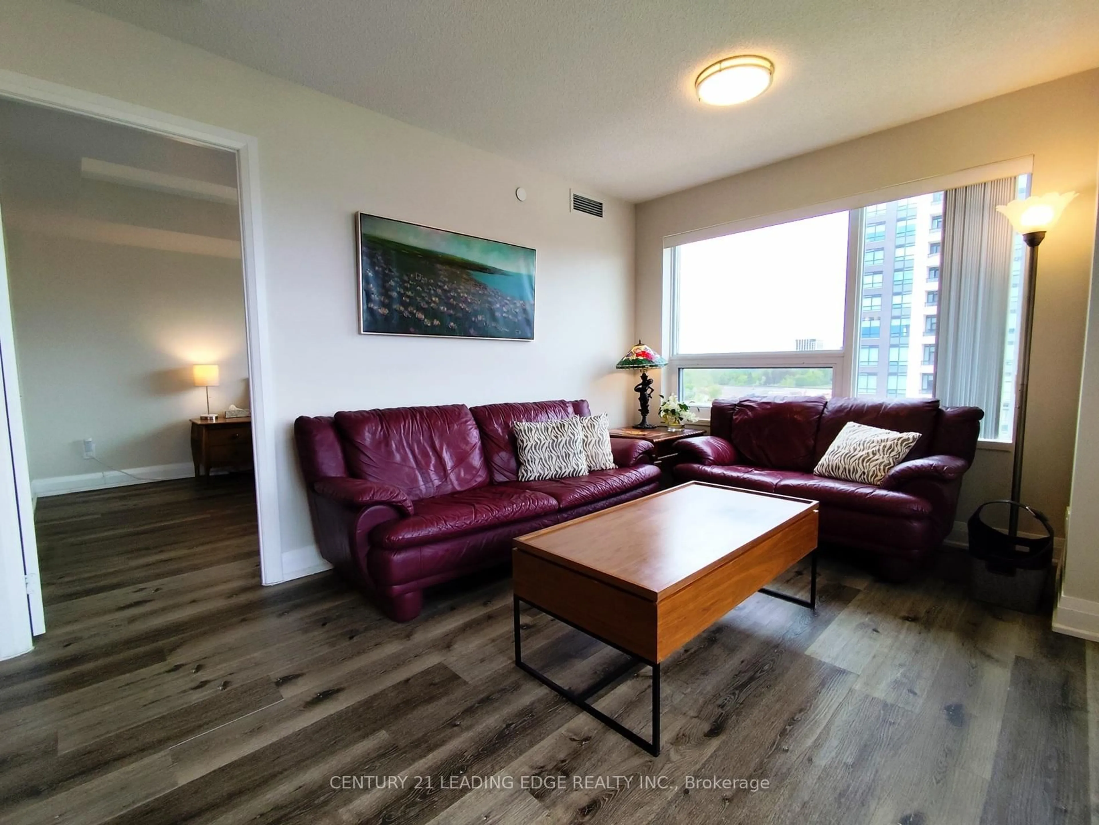 Living room with furniture, wood/laminate floor for 18 Uptown Dr #1010, Markham Ontario L3R 5M5