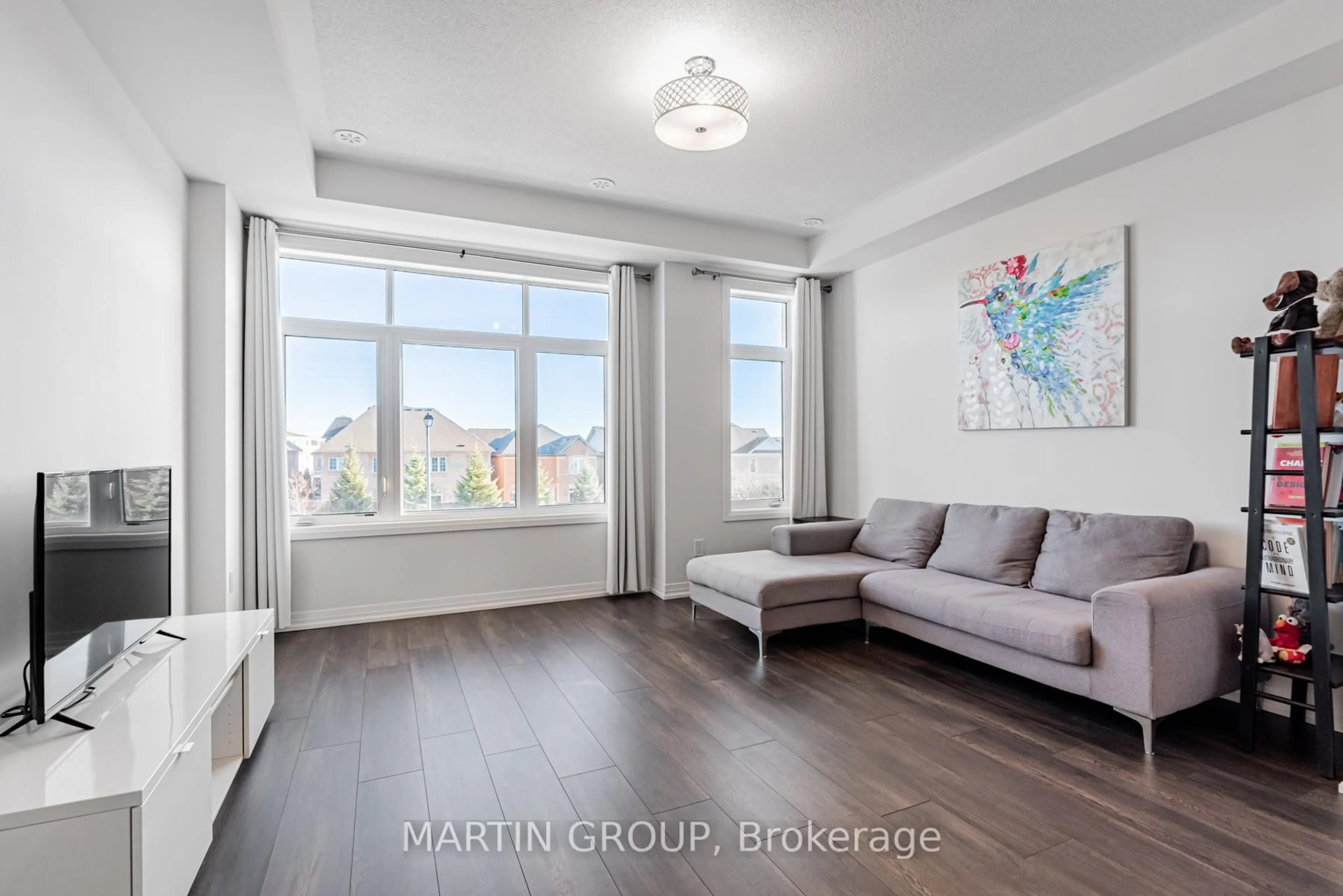Living room with furniture, wood/laminate floor for 13 Carneros Way, Markham Ontario L6B 1R2