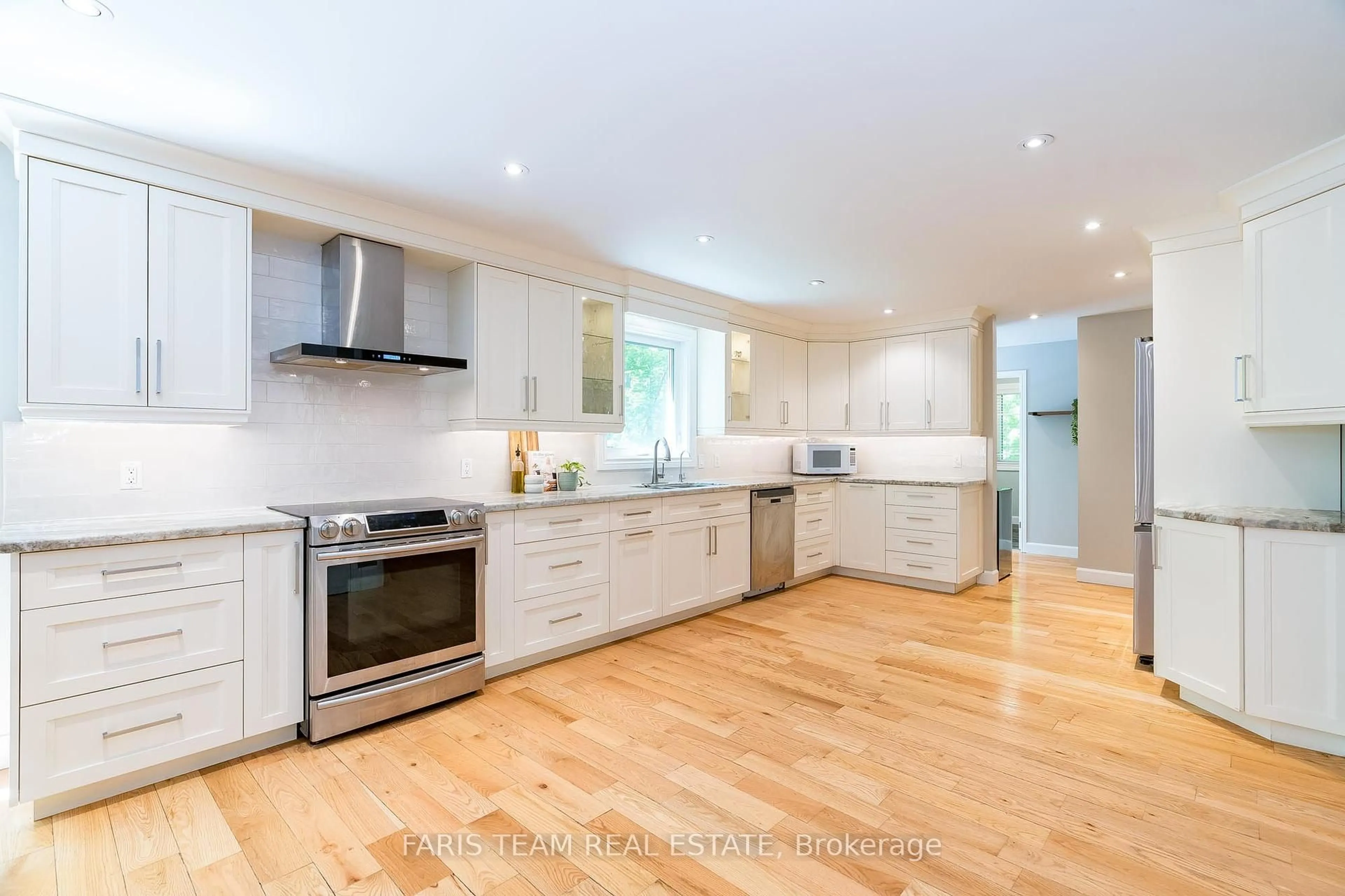 Open concept kitchen, wood/laminate floor for 47 Deer Lane, Adjala-Tosorontio Ontario L0M 1J0