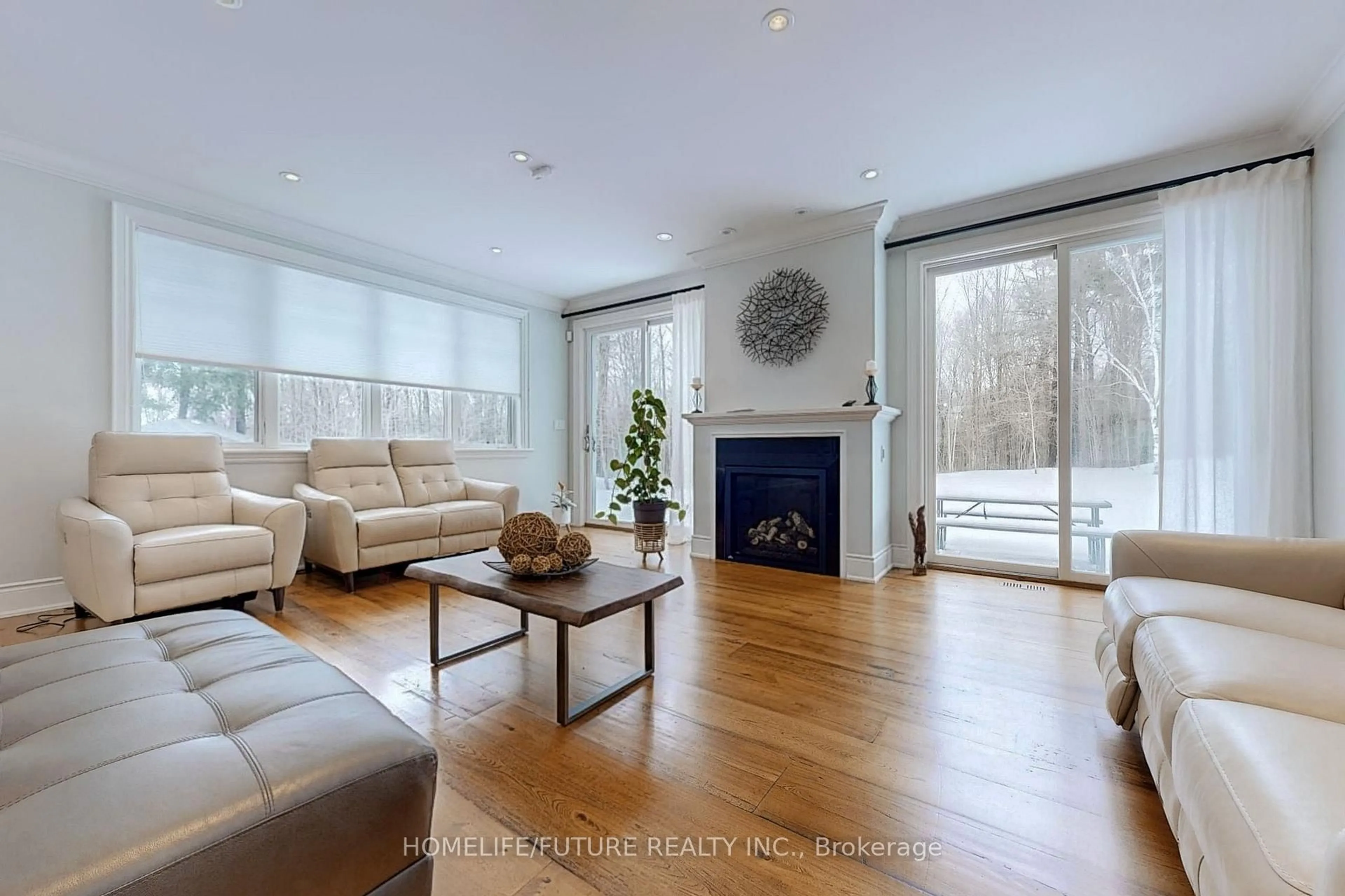 Living room with furniture, wood/laminate floor for 5556 Vivian Rd, Whitchurch-Stouffville Ontario L4A 3G9