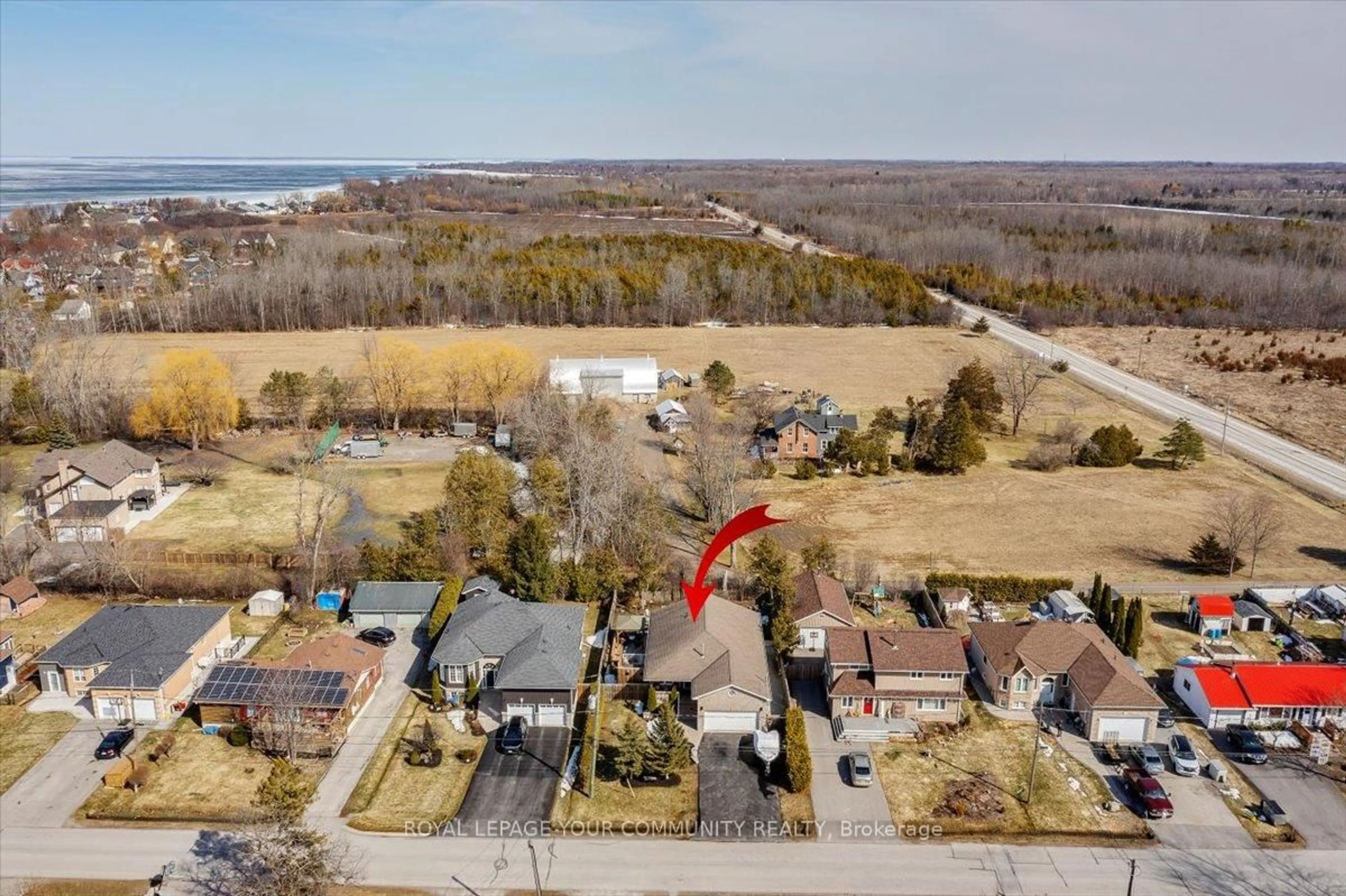 A pic from outside/outdoor area/front of a property/back of a property/a pic from drone, water/lake/river/ocean view for 825 Elmwood Rd, Georgina Ontario L4P 3E9