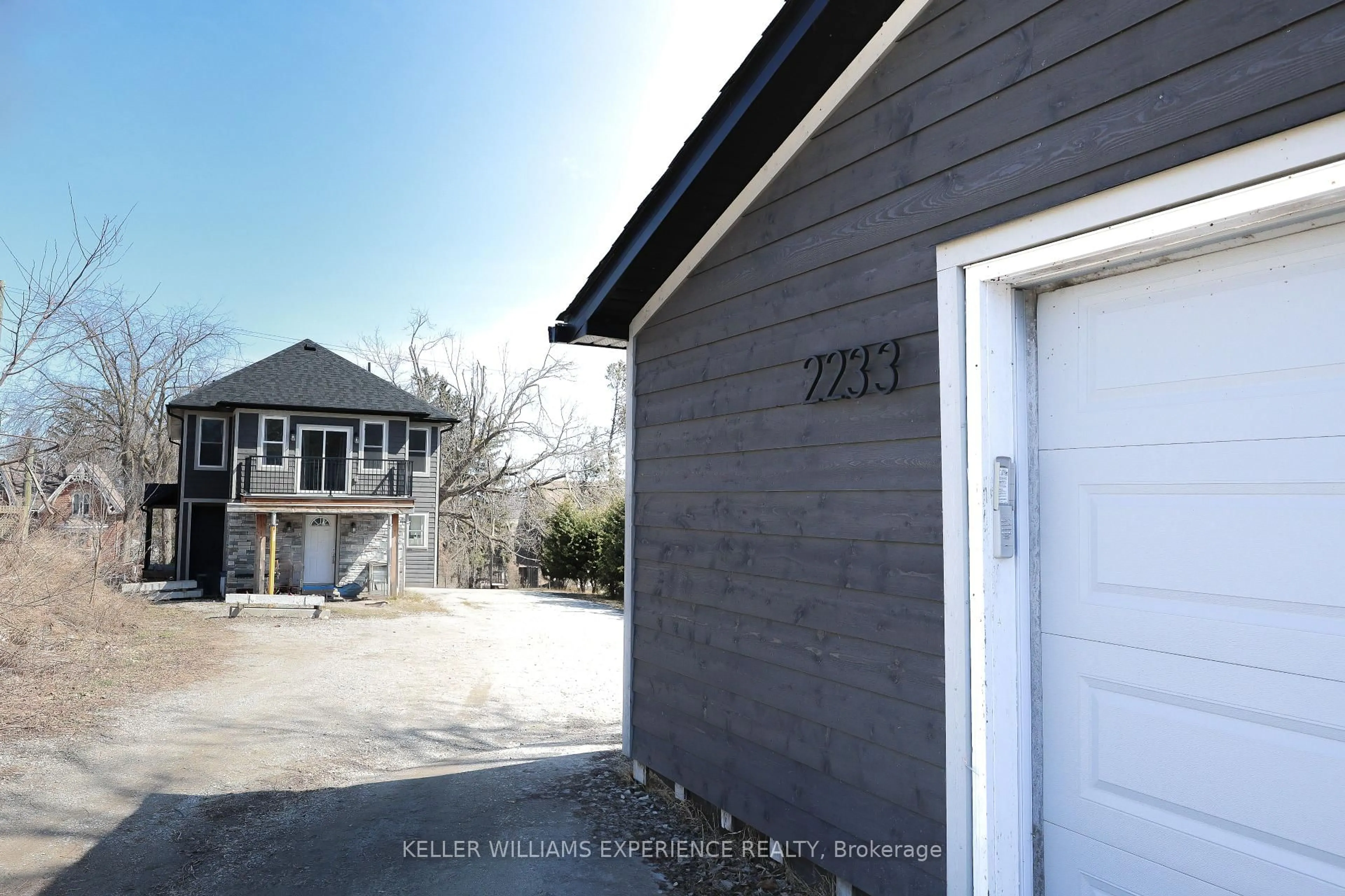 Home with vinyl exterior material, street for 2233 4th Line, Innisfil Ontario L0L 1K0