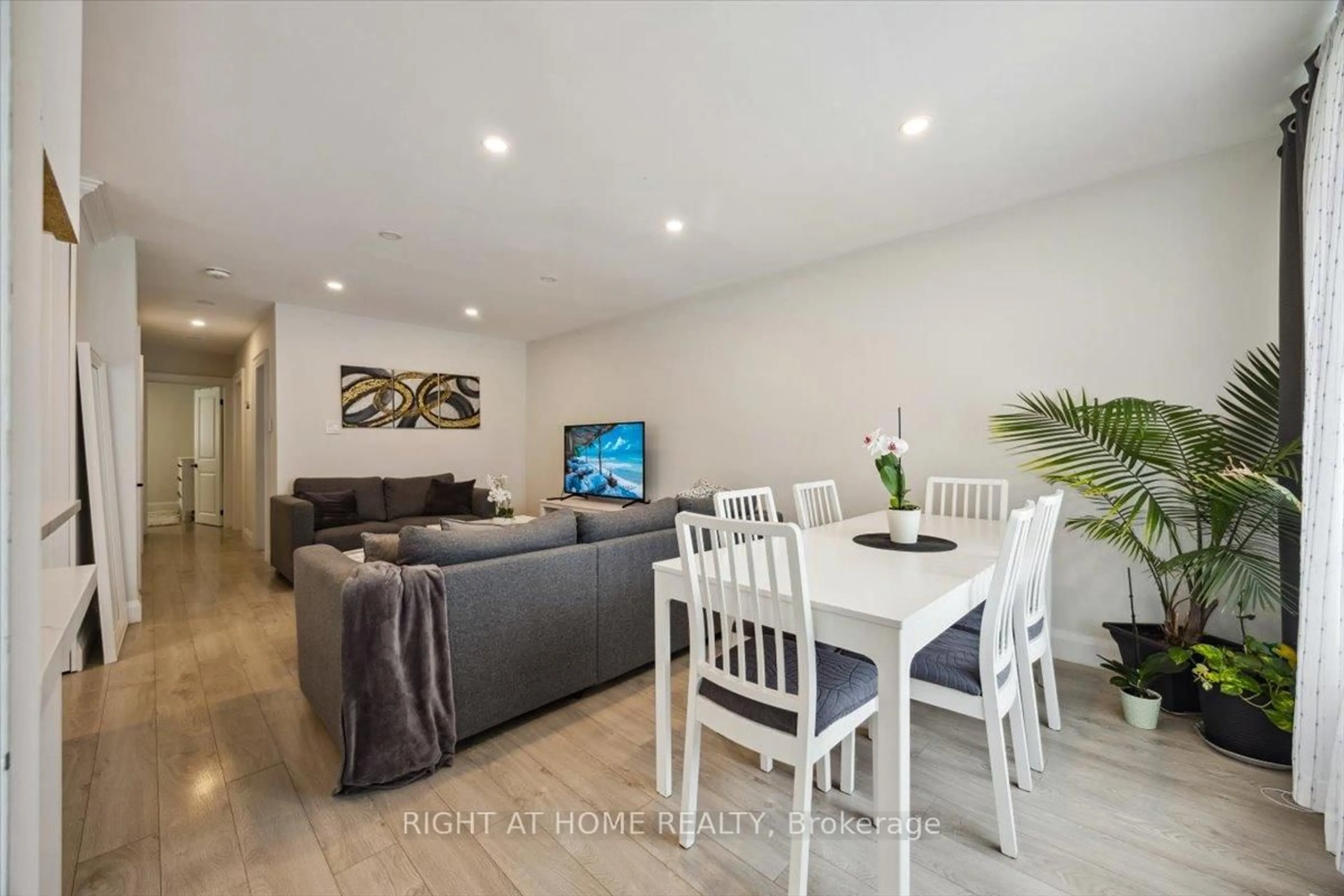 Living room with furniture, wood/laminate floor for 38 Walter Ave, Newmarket Ontario L3Y 2T3