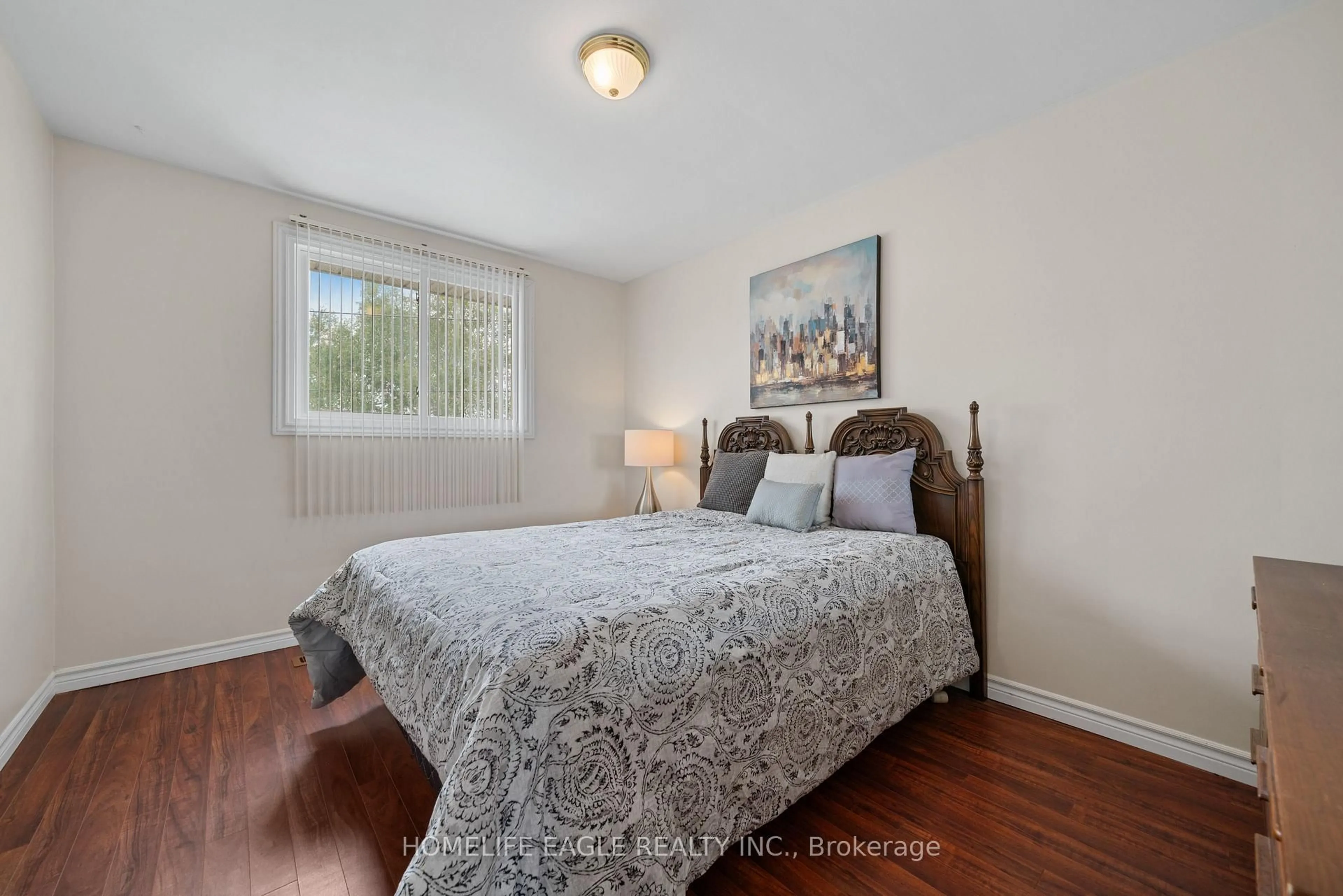 Bedroom with bed, wood/laminate floor for 135 Luxury Ave, Bradford West Gwillimbury Ontario L3Z 1T5