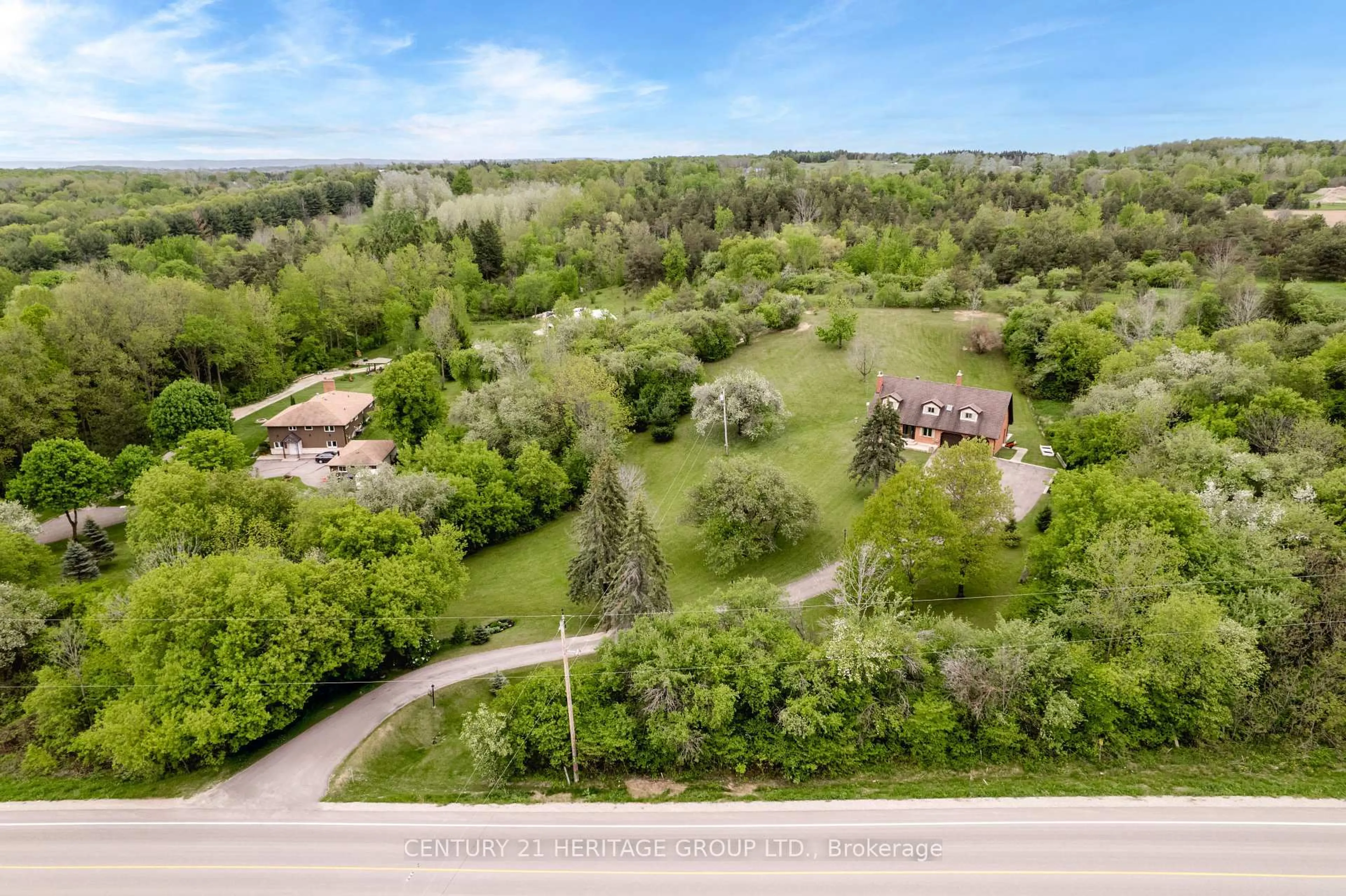 A pic from outside/outdoor area/front of a property/back of a property/a pic from drone, forest/trees view for 5827 7th Line, New Tecumseth Ontario L0G 1A0