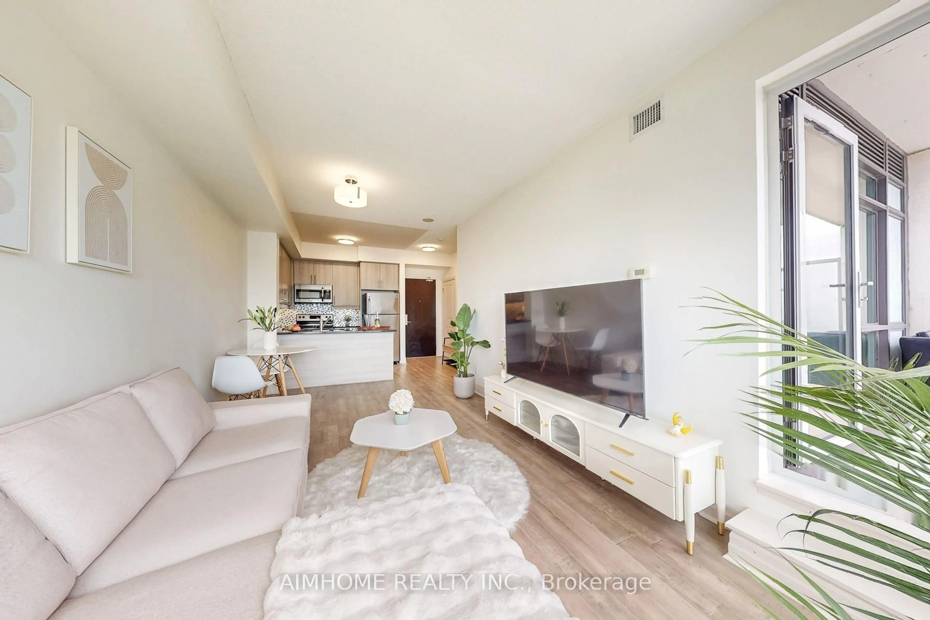 Living room with furniture, wood/laminate floor for 8110 Birchmount Rd #1004, Markham Ontario L6G 0E3