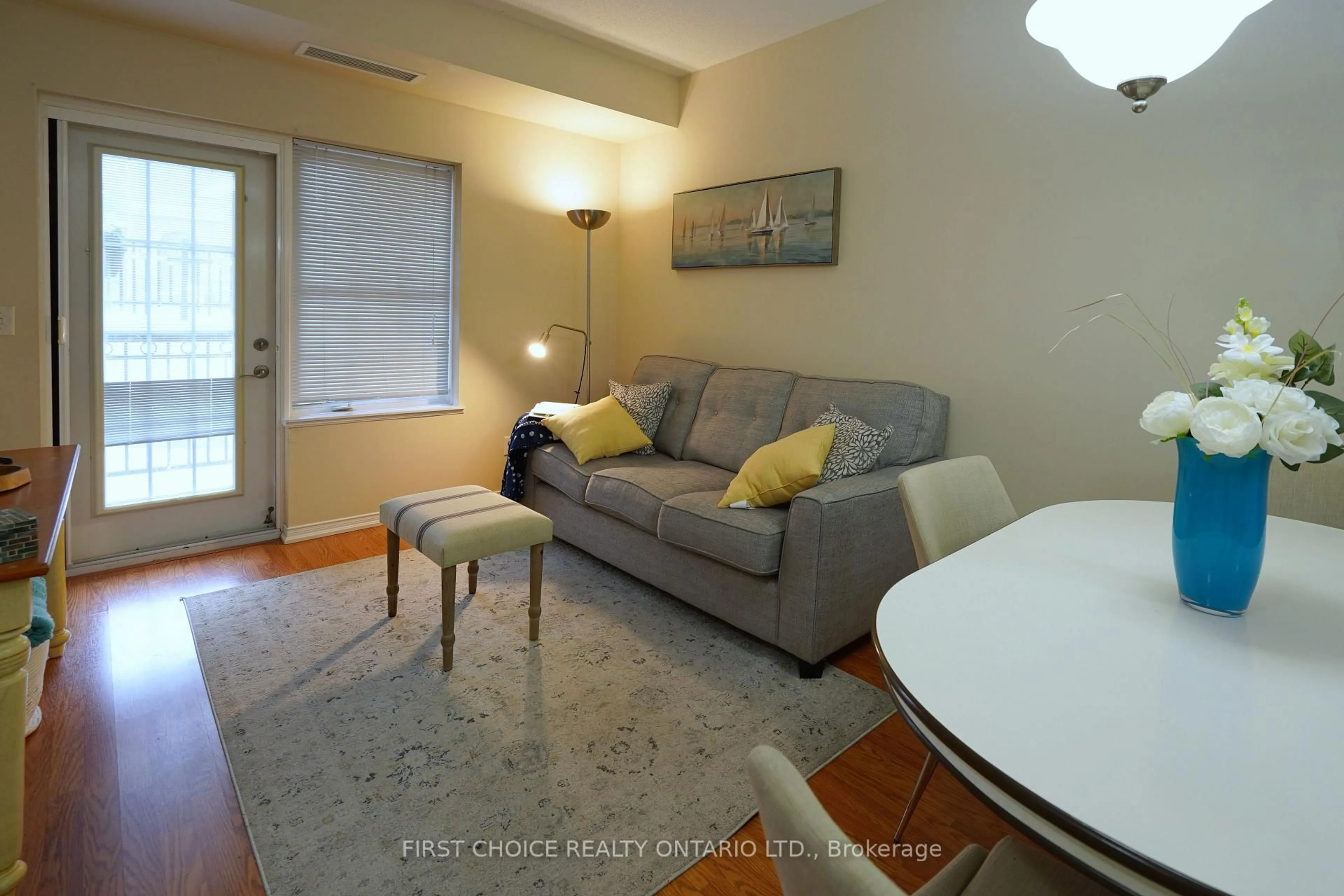 Living room with furniture, wood/laminate floor for 9973 Keele St #101, Vaughan Ontario L4N 7J7