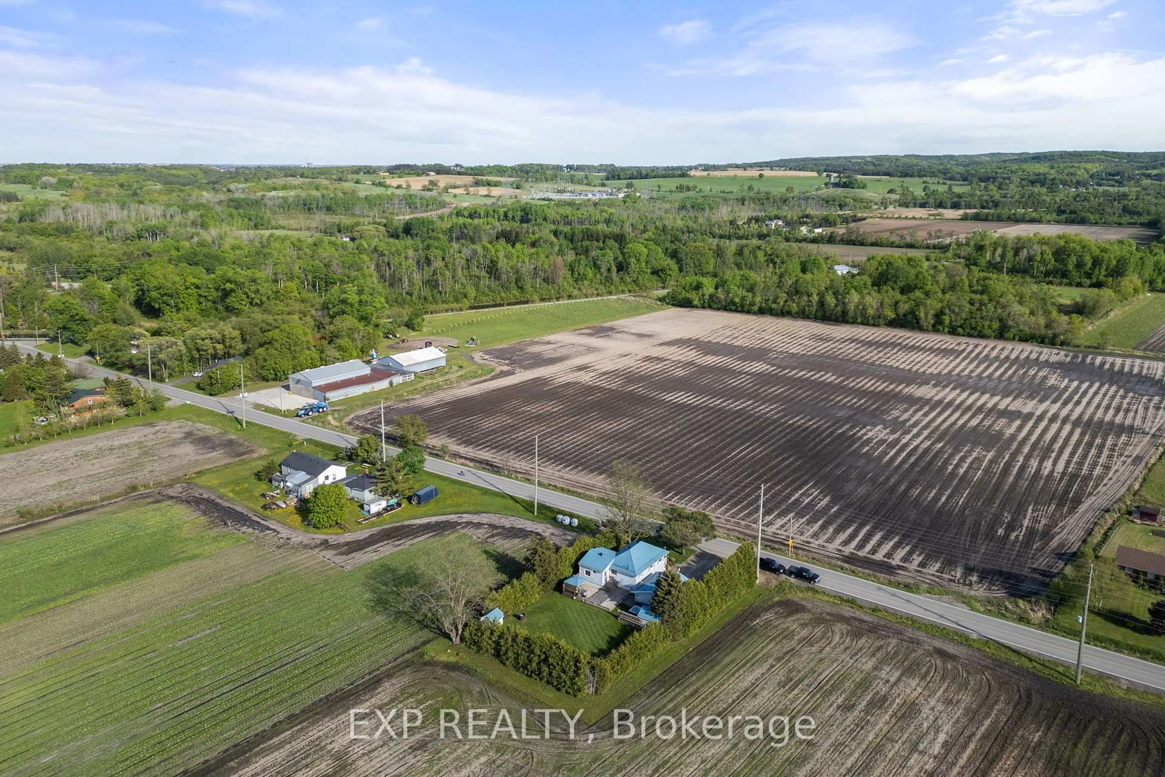A pic from outside/outdoor area/front of a property/back of a property/a pic from drone, water/lake/river/ocean view for 150 King St, King Ontario L3Y 4V9
