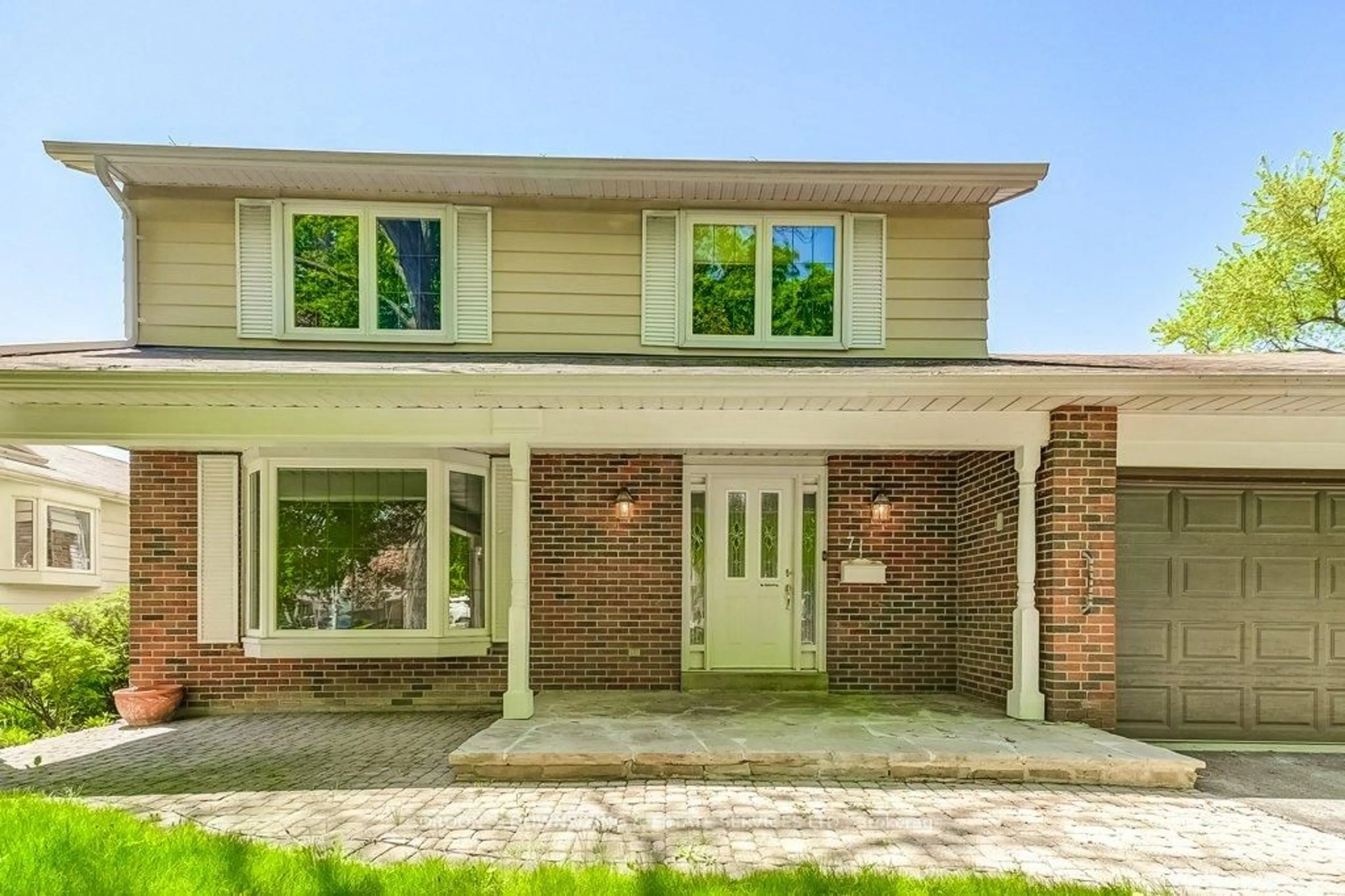 Home with brick exterior material, street for 71 Walkerton Dr, Markham Ontario L3P 1H9