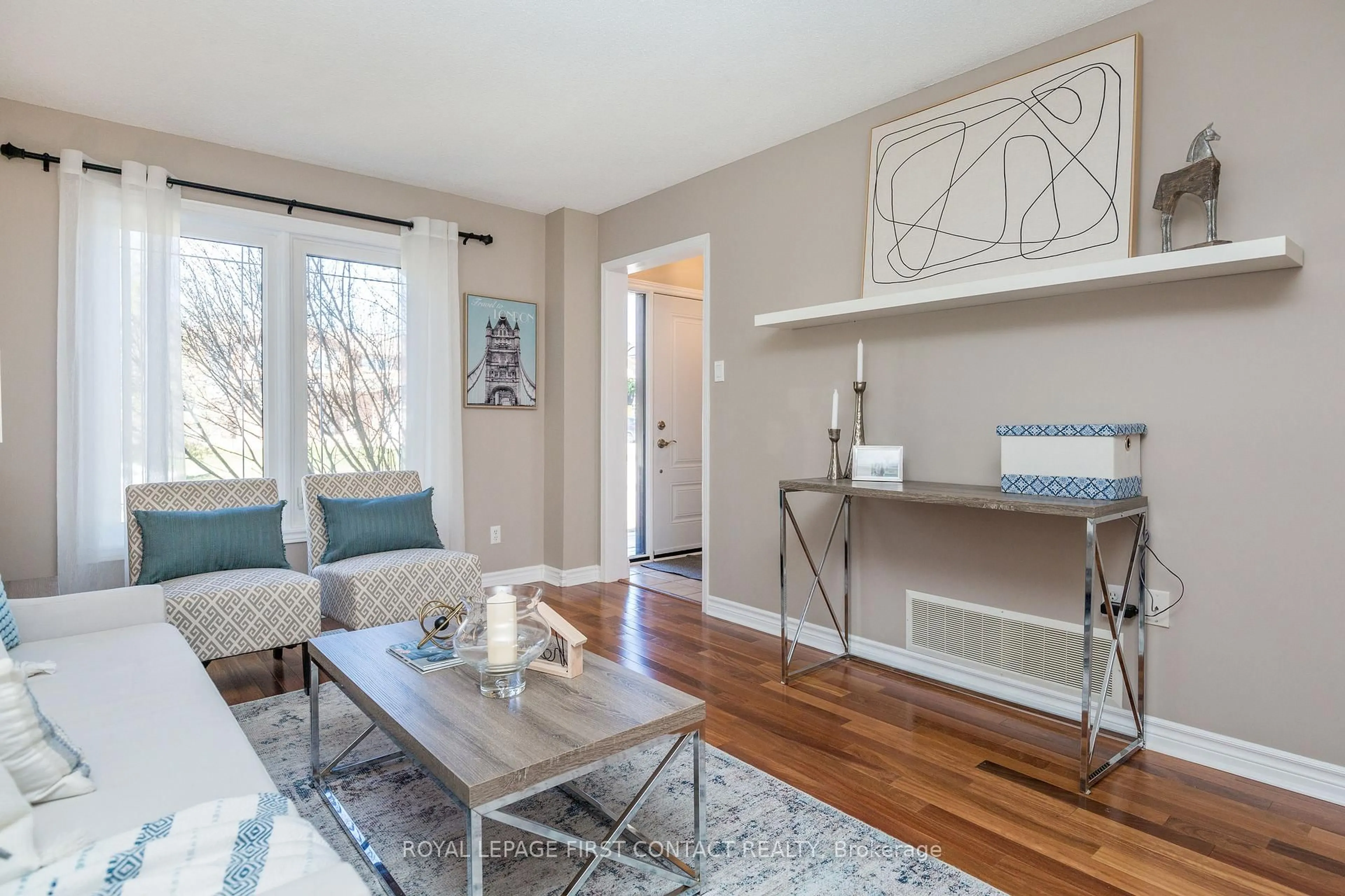 Living room with furniture, wood/laminate floor for 11 Heritage Rd, Innisfil Ontario L0L 1L0