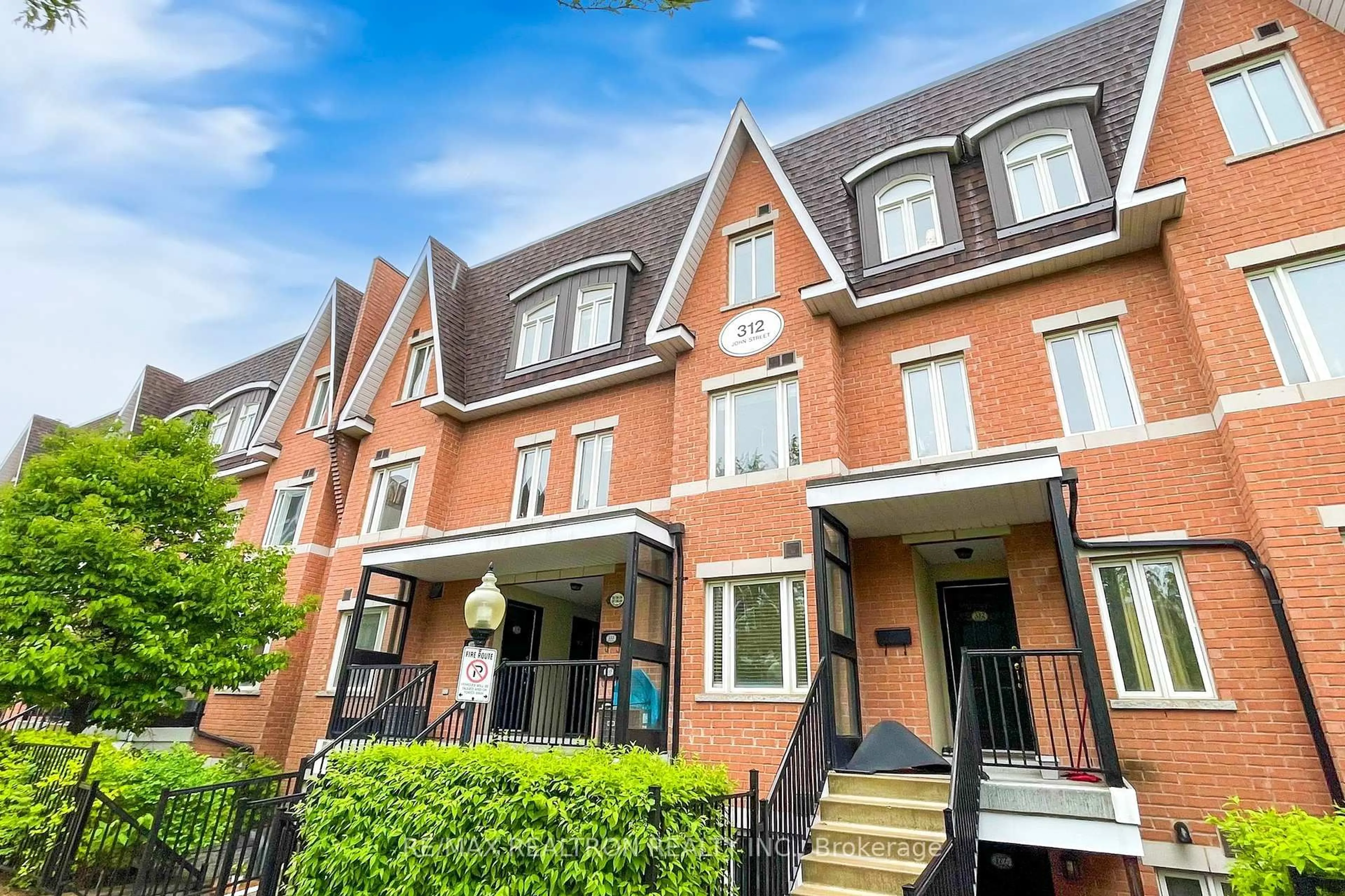 Home with brick exterior material, street for 312 John St #335, Markham Ontario L3T 0A7