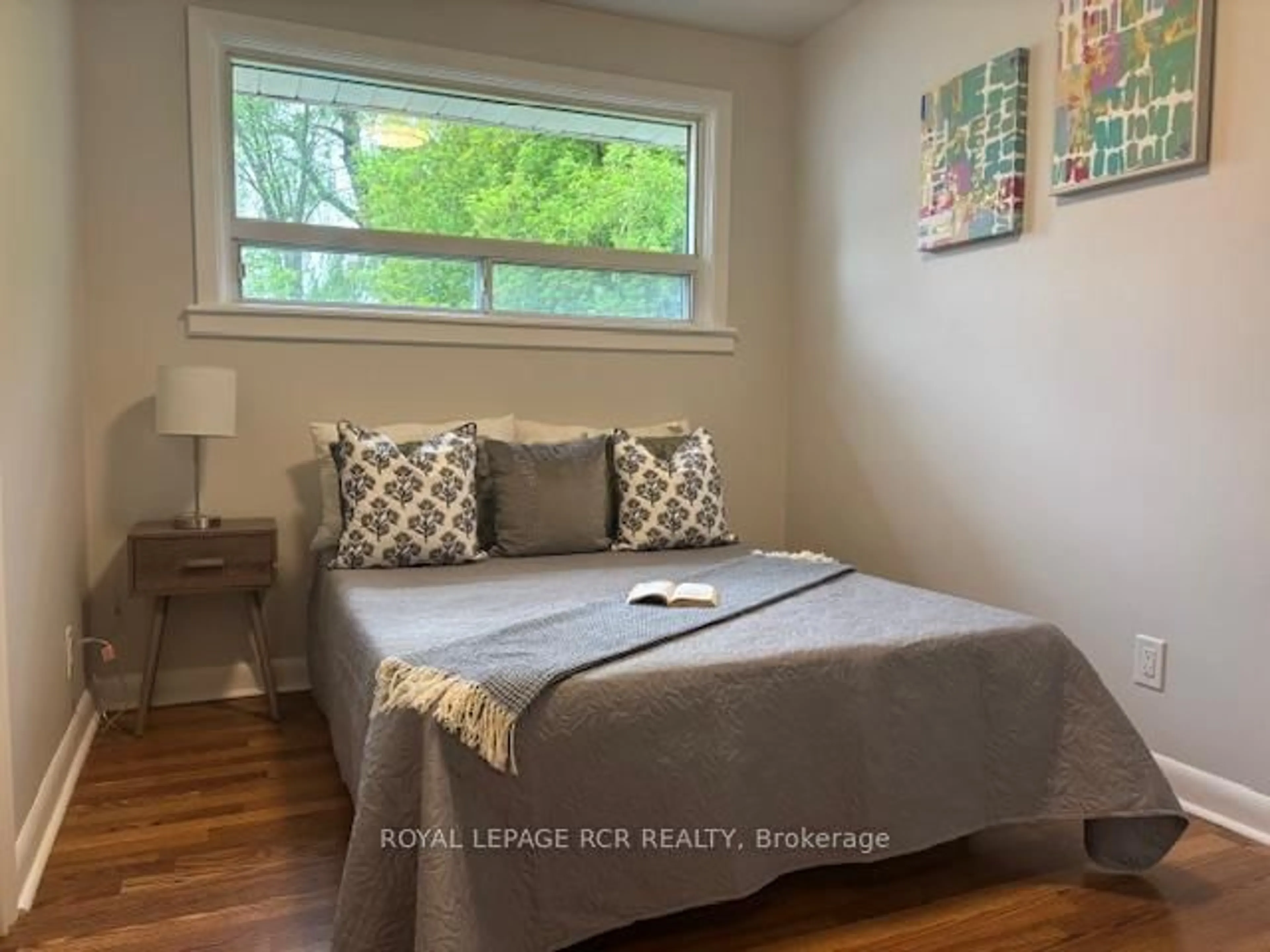 Bedroom with bed, wood/laminate floor for 12 Maple Ave, New Tecumseth Ontario L0G 1A0