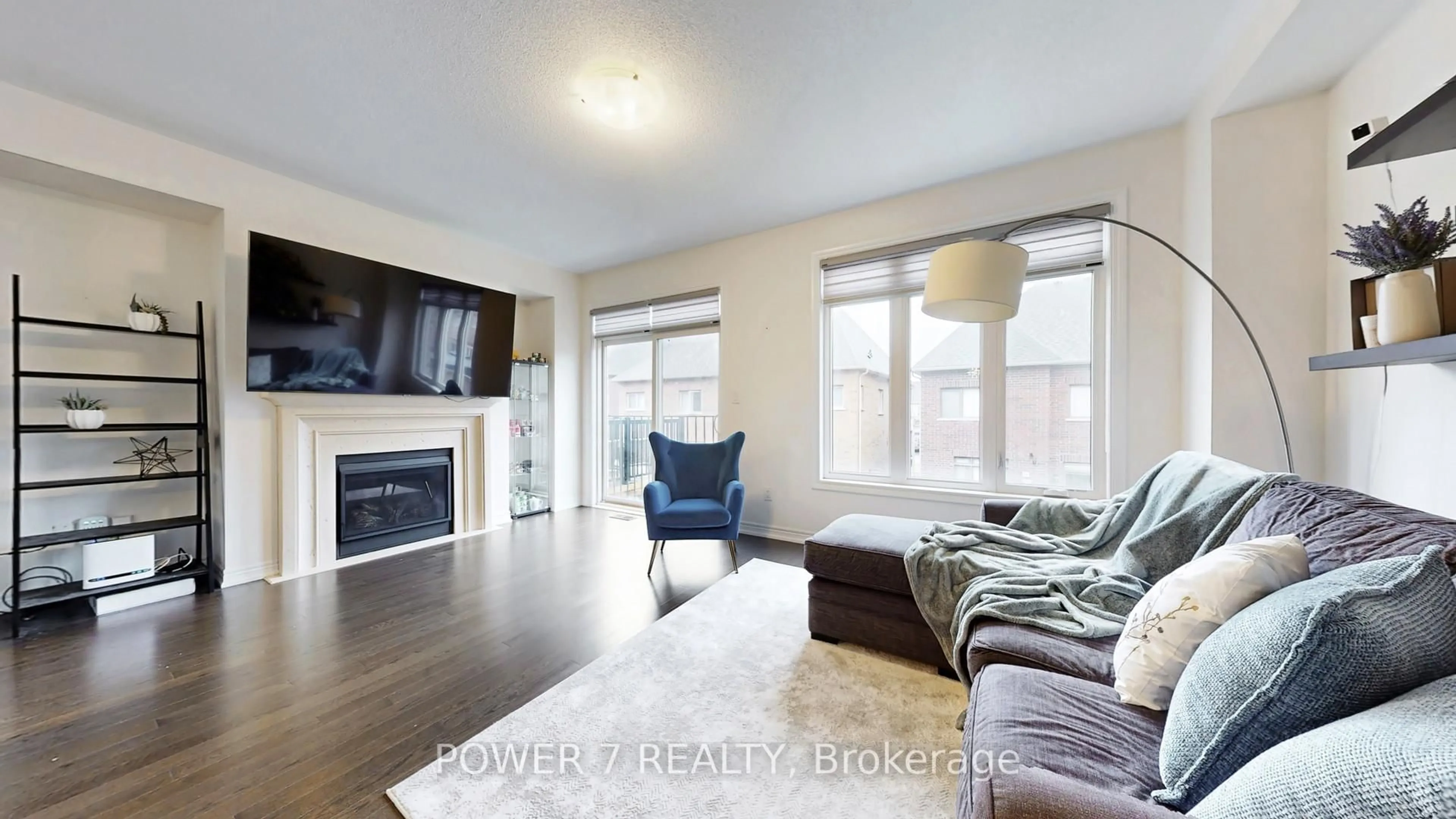 Living room with furniture, wood/laminate floor for 381 Chouinard Way, Aurora Ontario L4G 1A6