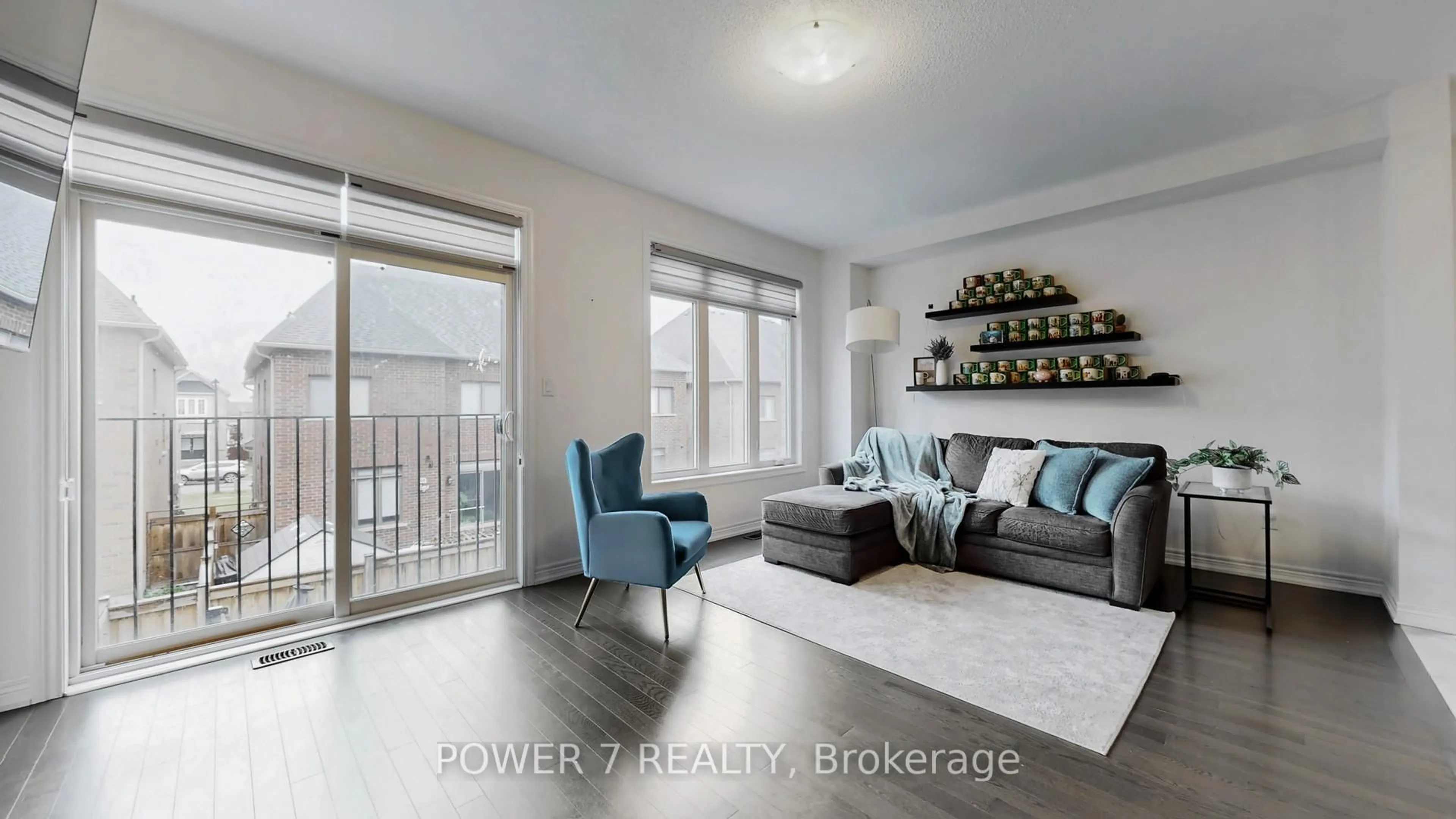 Living room with furniture, wood/laminate floor for 381 Chouinard Way, Aurora Ontario L4G 1A6