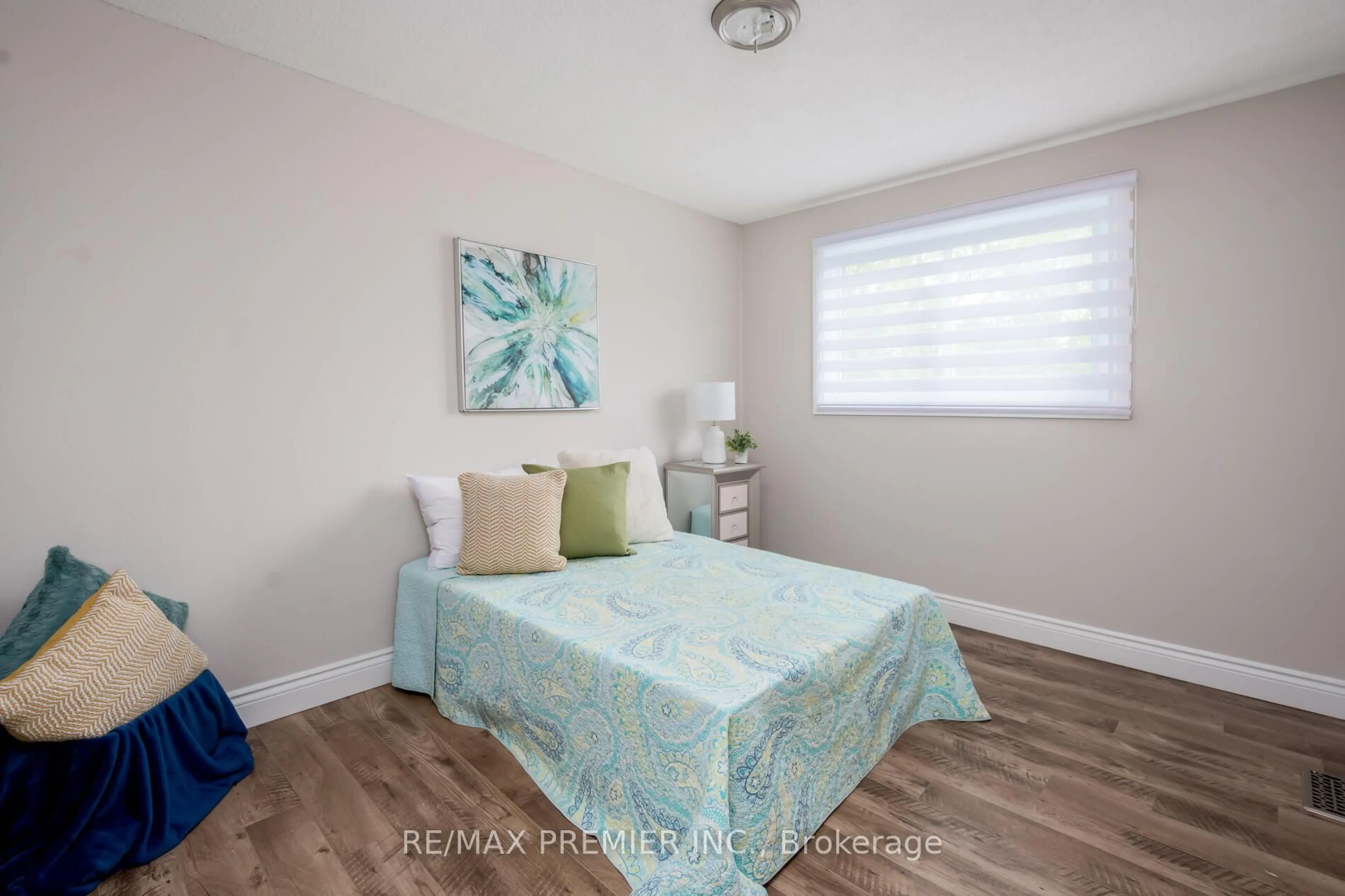 Bedroom with bed, wood/laminate floor for 15 Maple Ave, New Tecumseth Ontario L0G 1A0