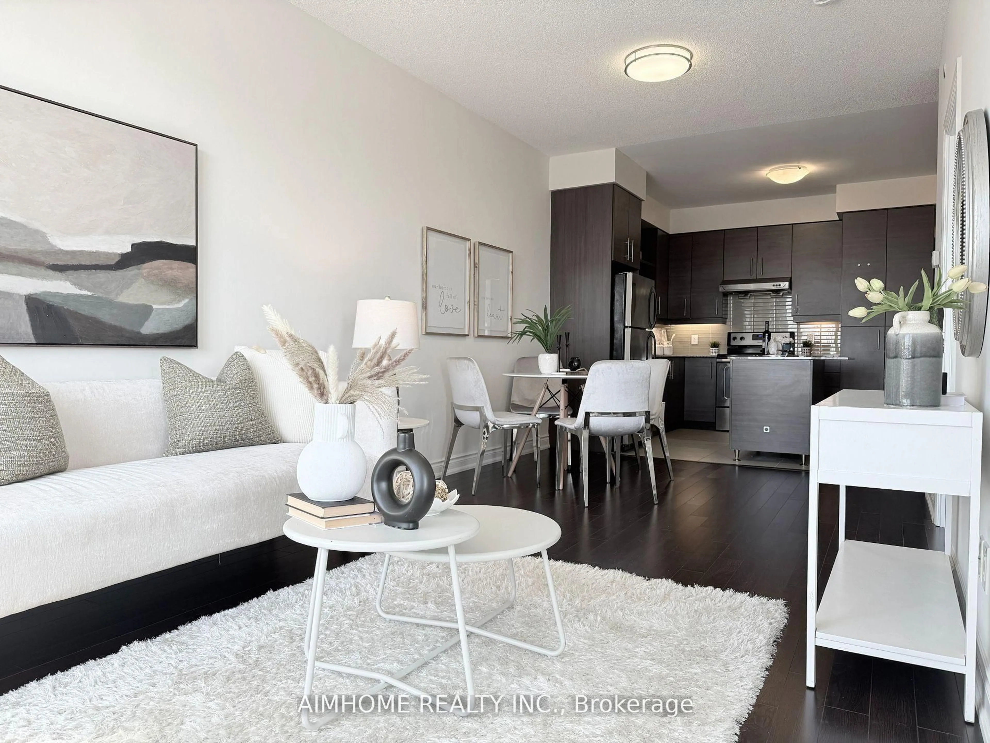 Living room with furniture, wood/laminate floor for 325 South Park Rd #1008, Markham Ontario L3T 0B8