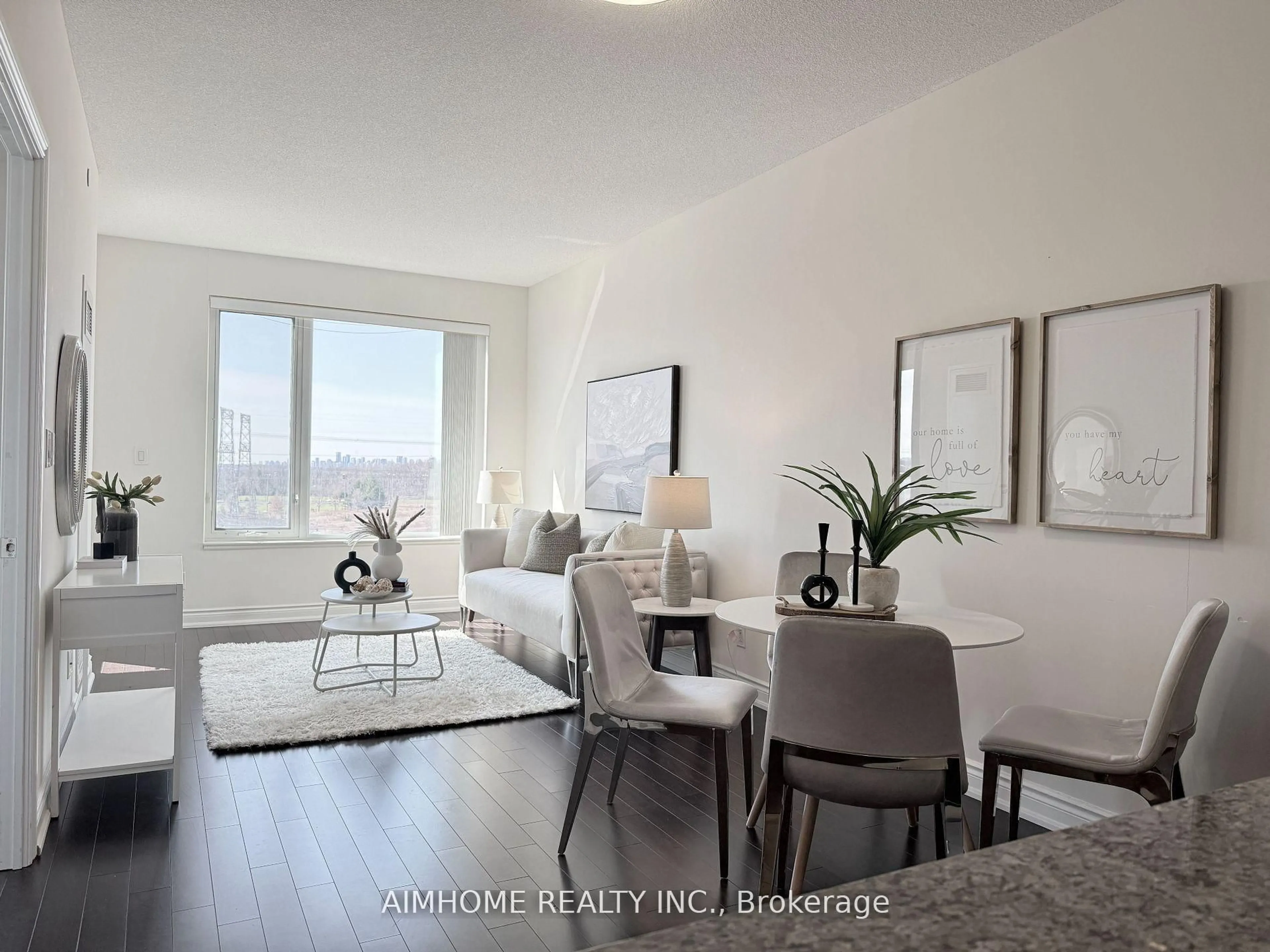 Living room with furniture, wood/laminate floor for 325 South Park Rd #1008, Markham Ontario L3T 0B8