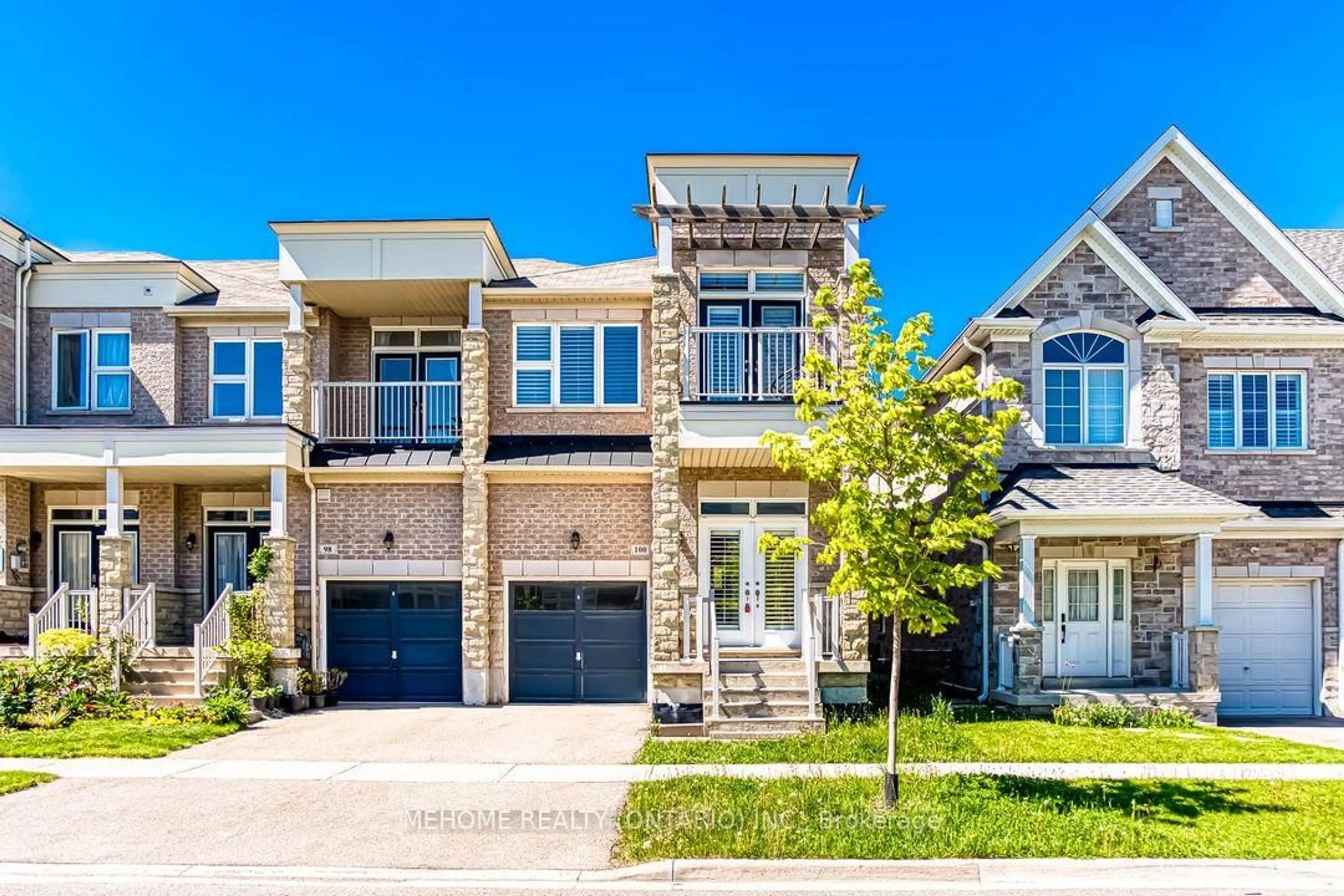Home with brick exterior material, street for 100 Ian Baron Ave, Markham Ontario L3R 5S6