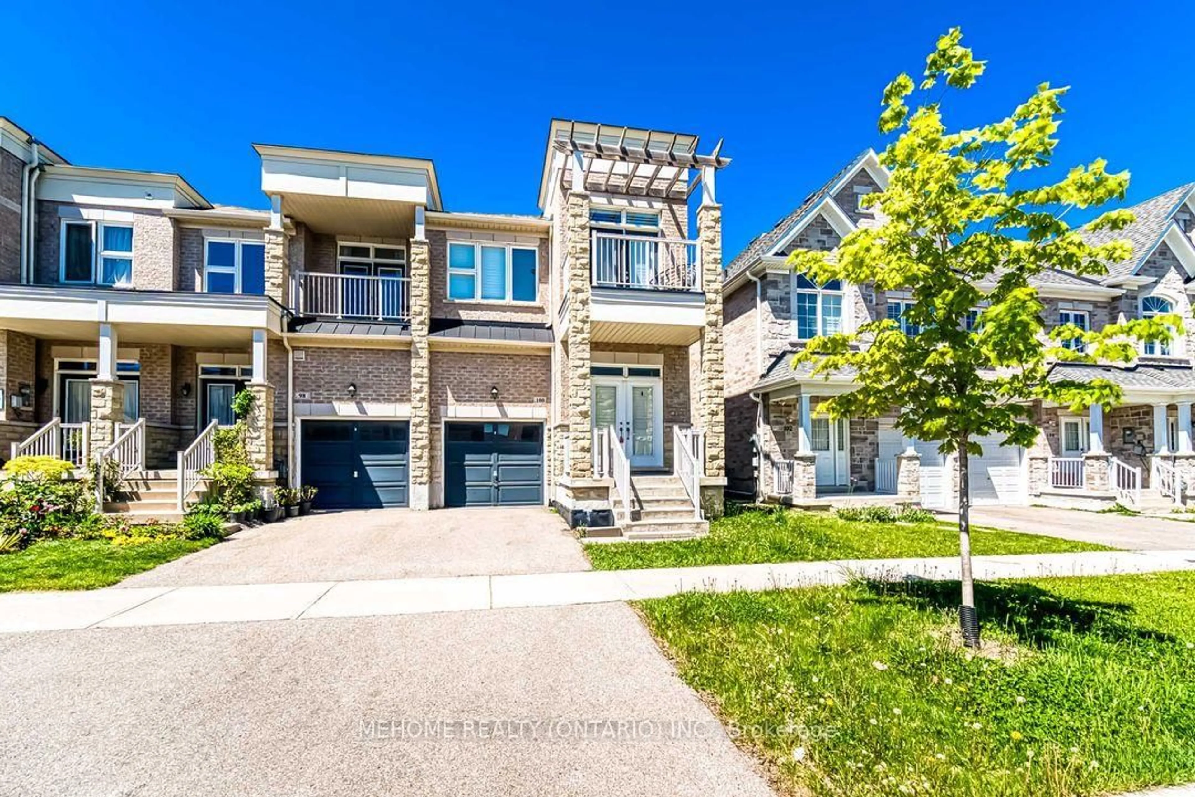 Home with brick exterior material, street for 100 Ian Baron Ave, Markham Ontario L3R 5S6