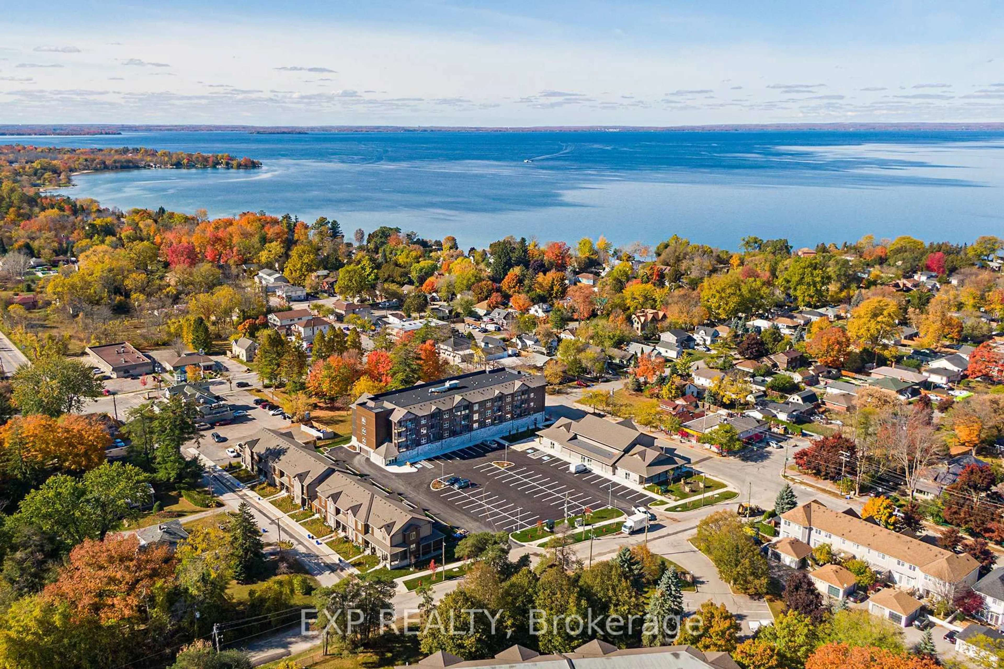 A pic from outside/outdoor area/front of a property/back of a property/a pic from drone, water/lake/river/ocean view for 110 Grew Blvd #407, Georgina Ontario L0E 1L0