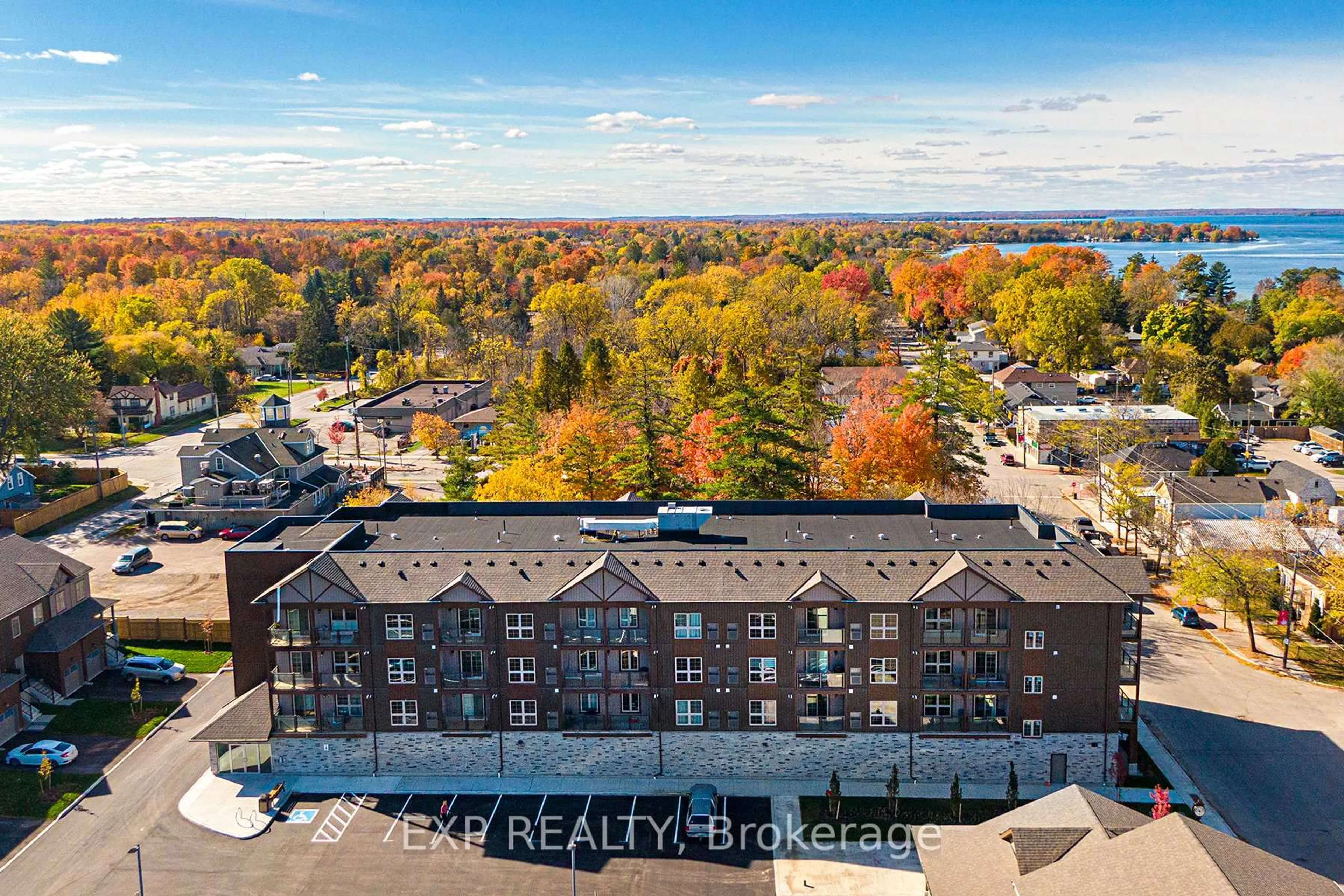 A pic from outside/outdoor area/front of a property/back of a property/a pic from drone, city buildings view from balcony for 110 Grew Blvd #407, Georgina Ontario L0E 1L0