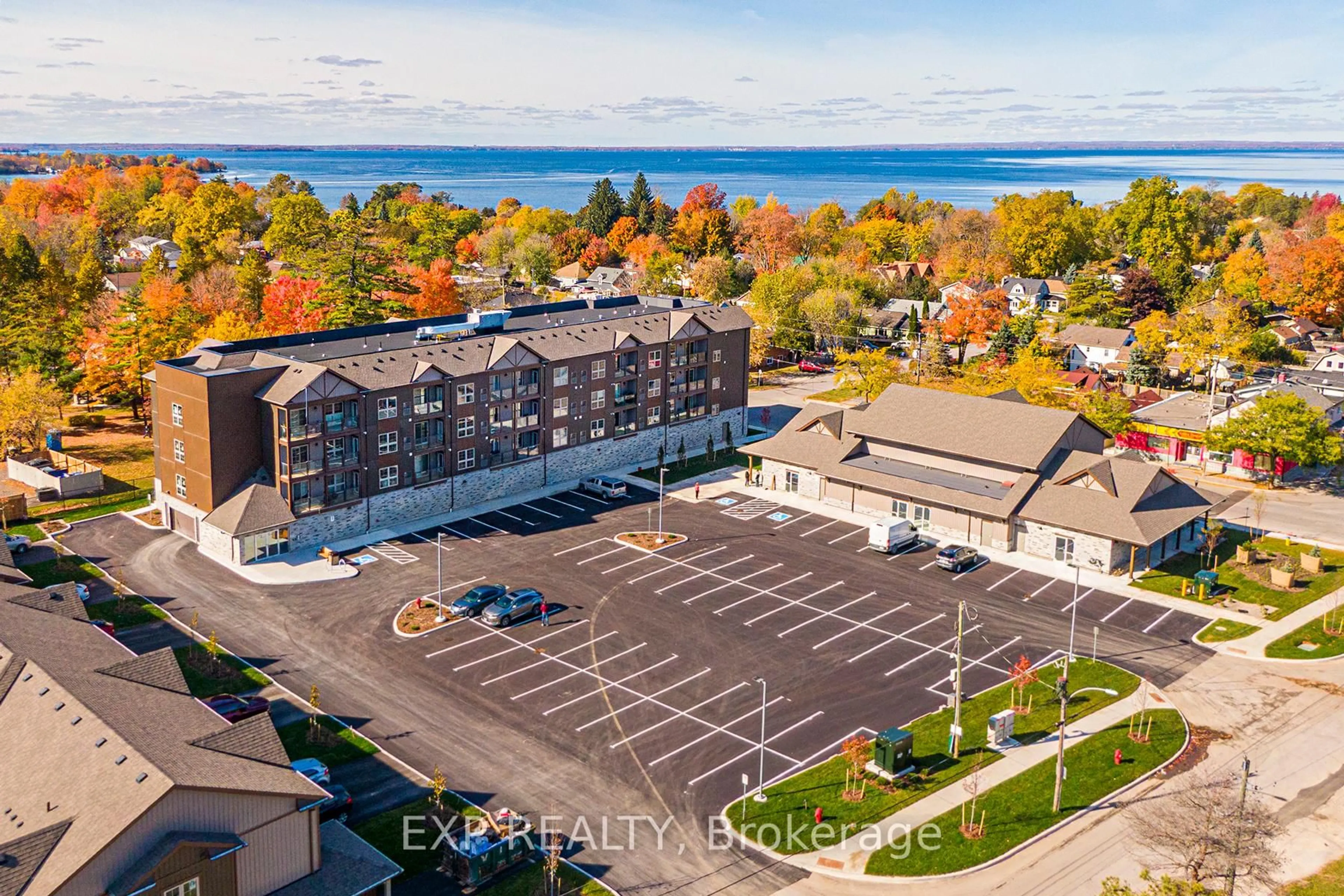 A pic from outside/outdoor area/front of a property/back of a property/a pic from drone, water/lake/river/ocean view for 110 Grew Blvd #407, Georgina Ontario L0E 1L0