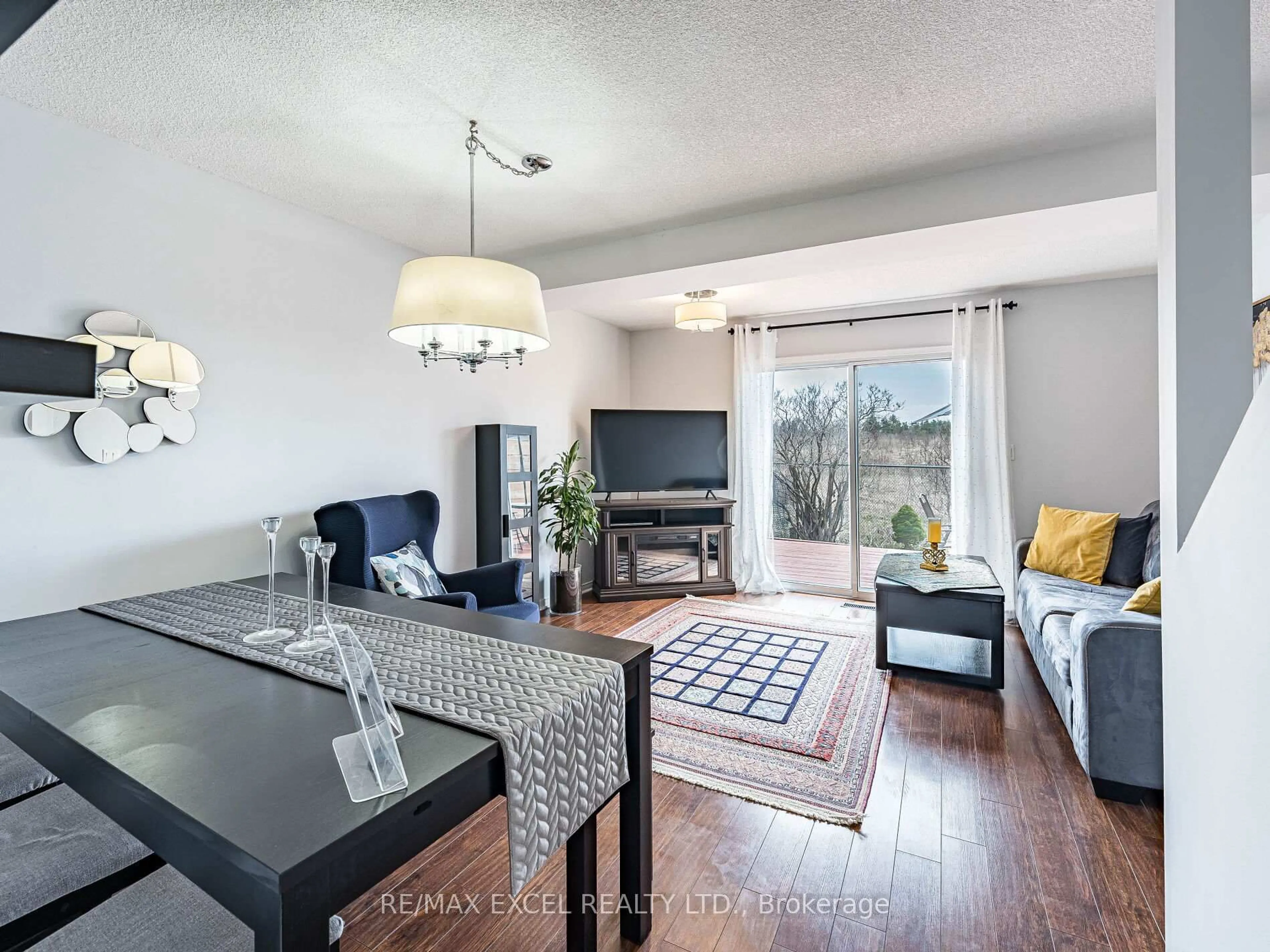 Living room with furniture, wood/laminate floor for 97 William Curtis Circ, Newmarket Ontario L3Y 8L8