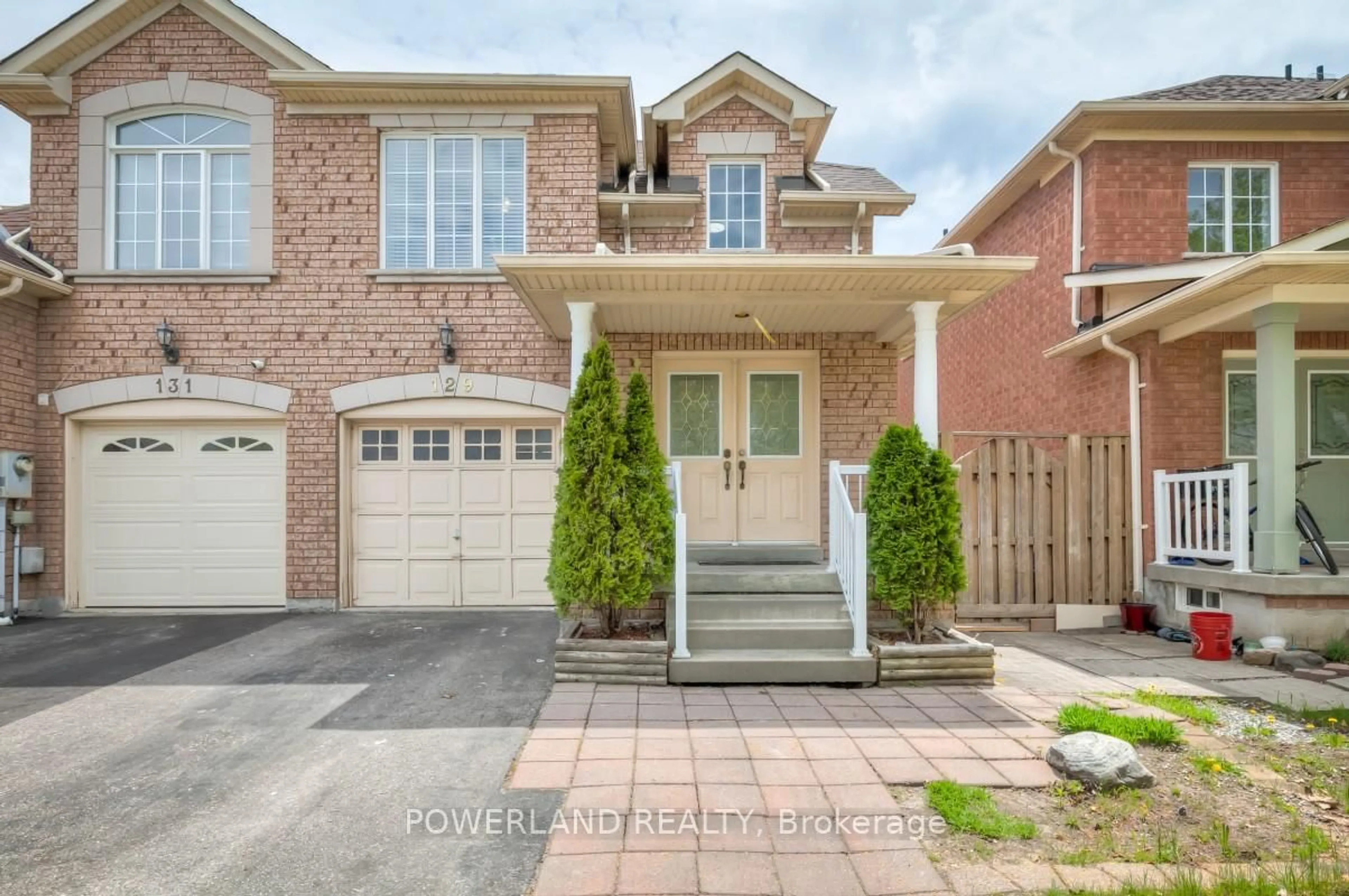 Home with brick exterior material, street for 129 Zio Carlo Dr, Markham Ontario L3R 4X4