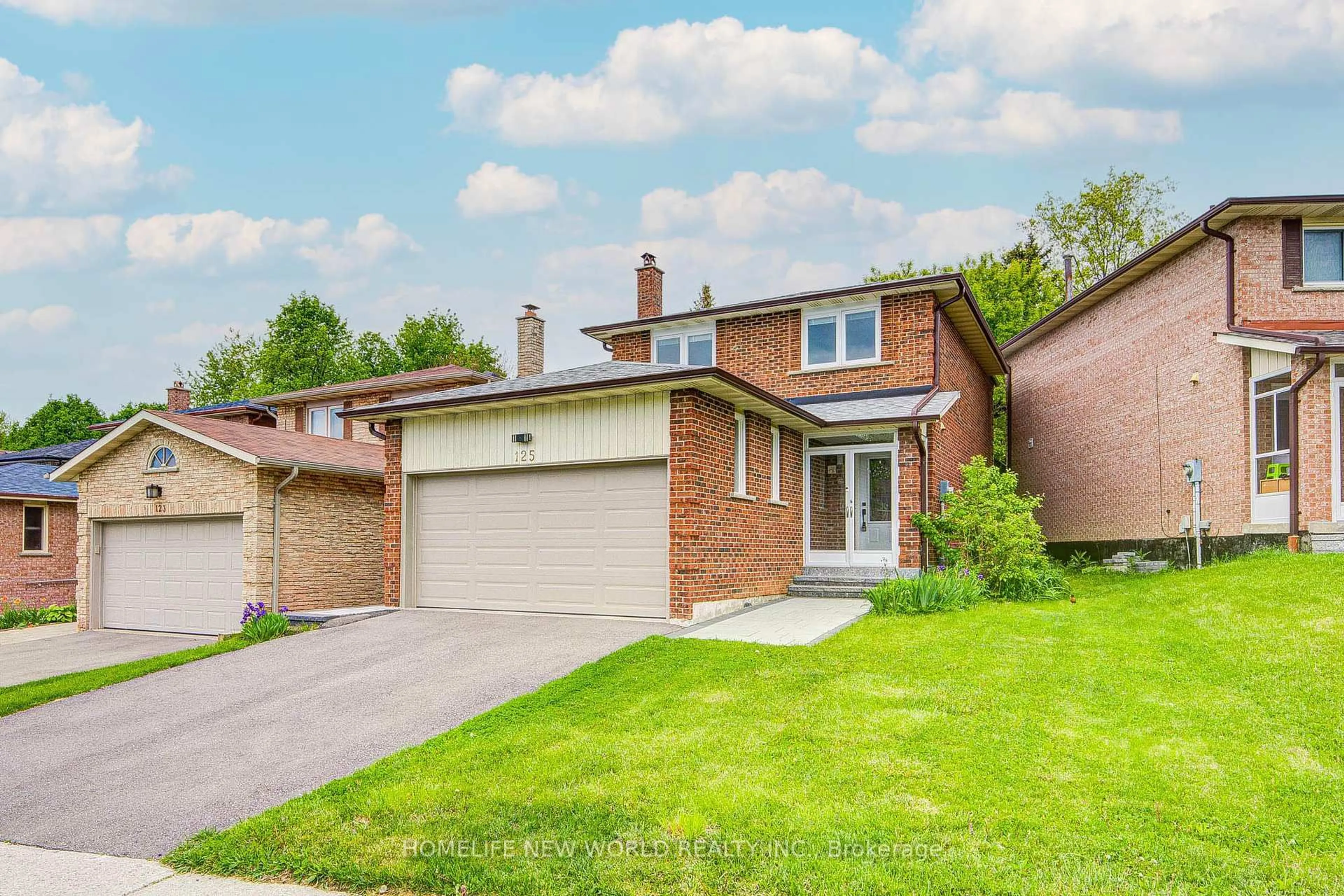 Home with brick exterior material, street for 125 Major Buttons Dr, Markham Ontario L3P 3X7