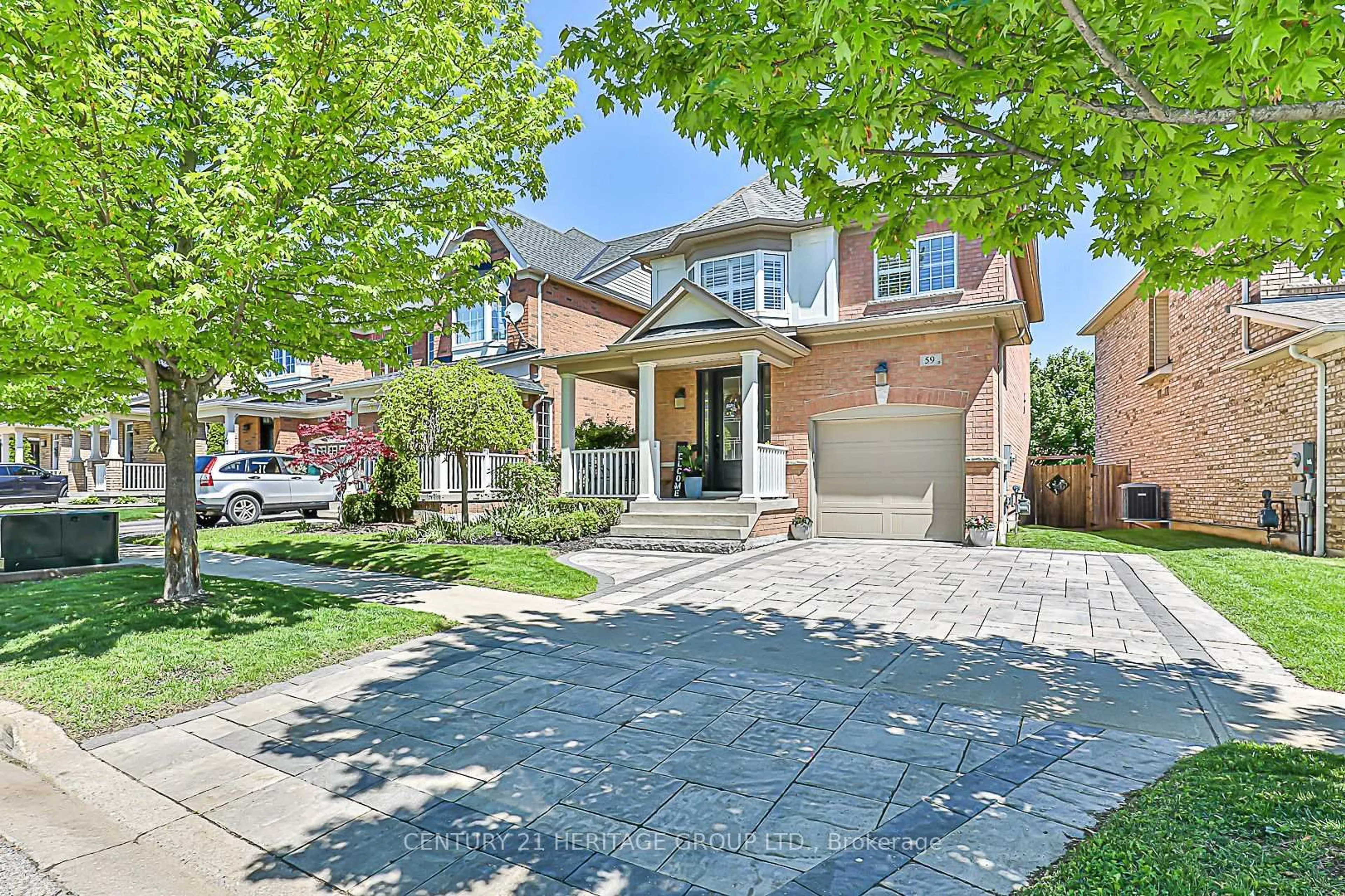 Home with brick exterior material, street for 59 Amos Lehman Way, Whitchurch-Stouffville Ontario L4A 0L3