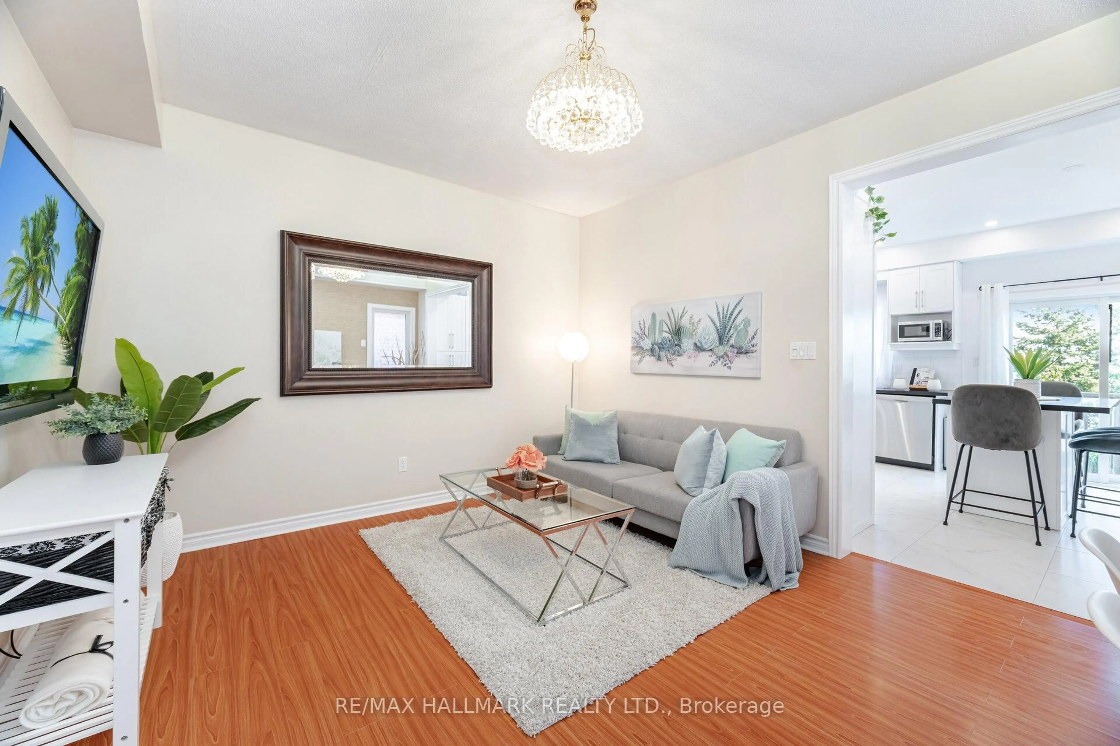 Living room with furniture, wood/laminate floor for 569 Reeves Way Blvd, Whitchurch-Stouffville Ontario L4A 0H1