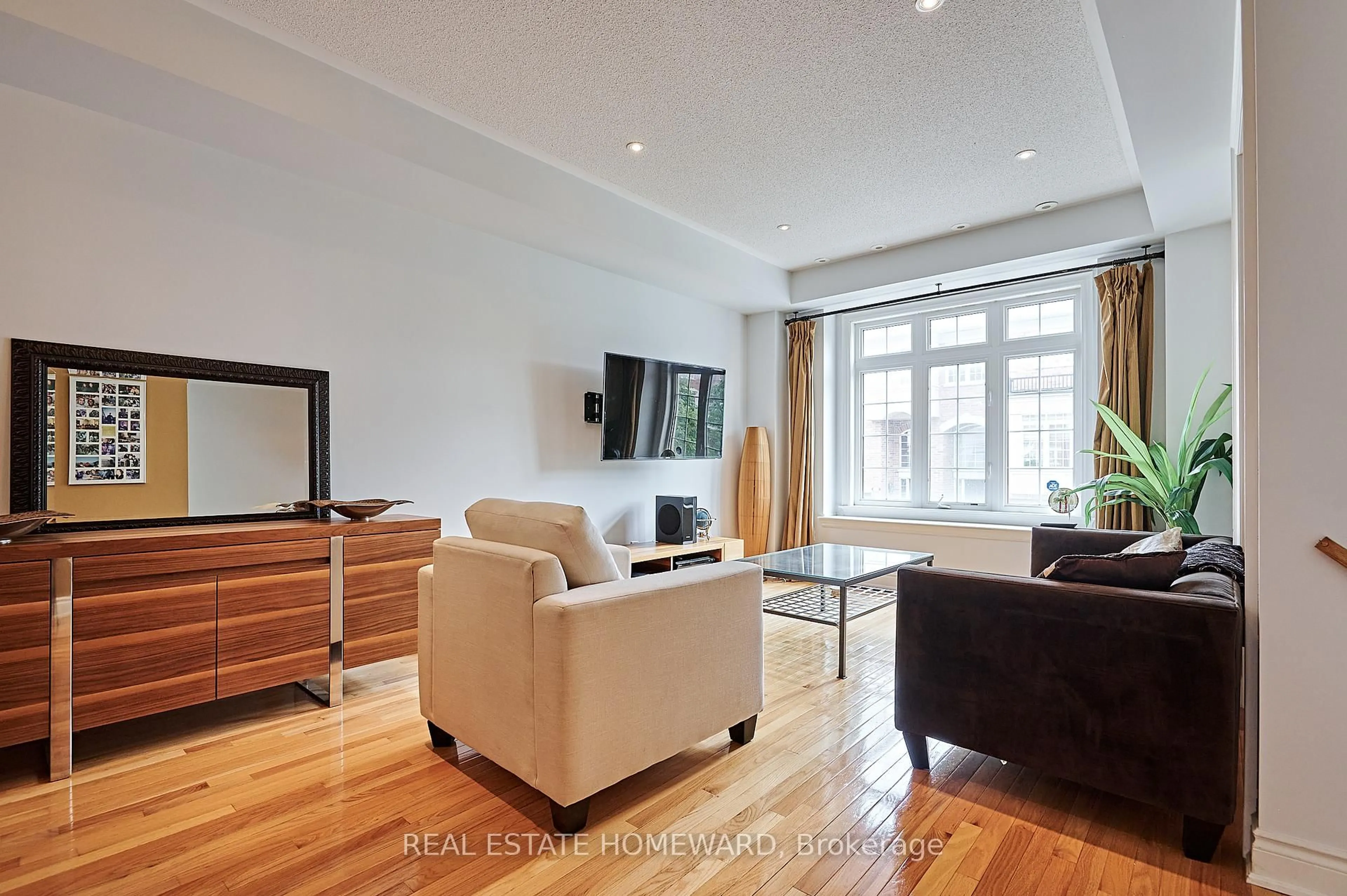 Living room with furniture, wood/laminate floor for 4 Isaac Devins Ave, Vaughan Ontario L4L 0A4