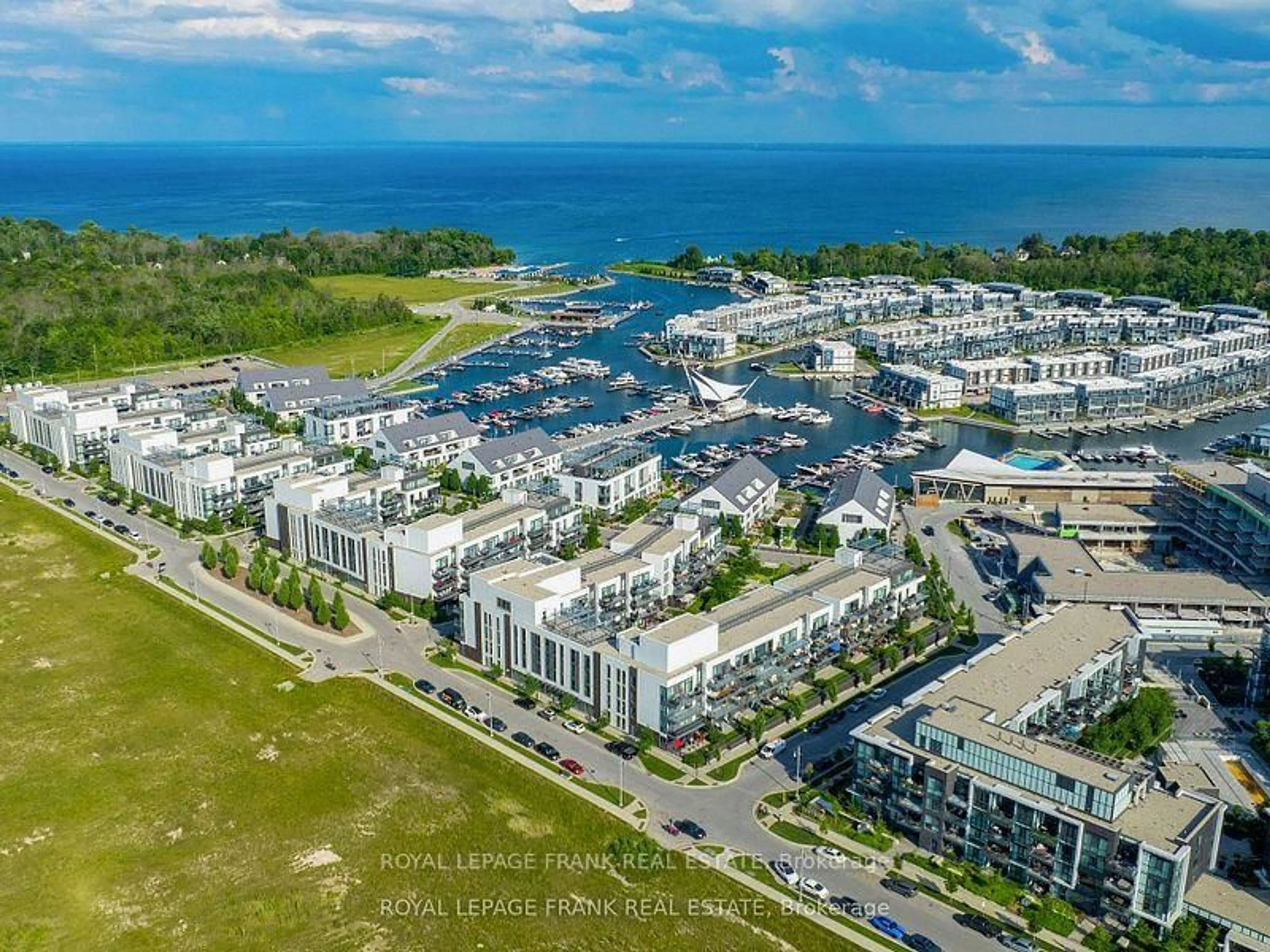 A pic from outside/outdoor area/front of a property/back of a property/a pic from drone, water/lake/river/ocean view for 333 Sea Ray Ave ##D313, Innisfil Ontario L9S 2P7